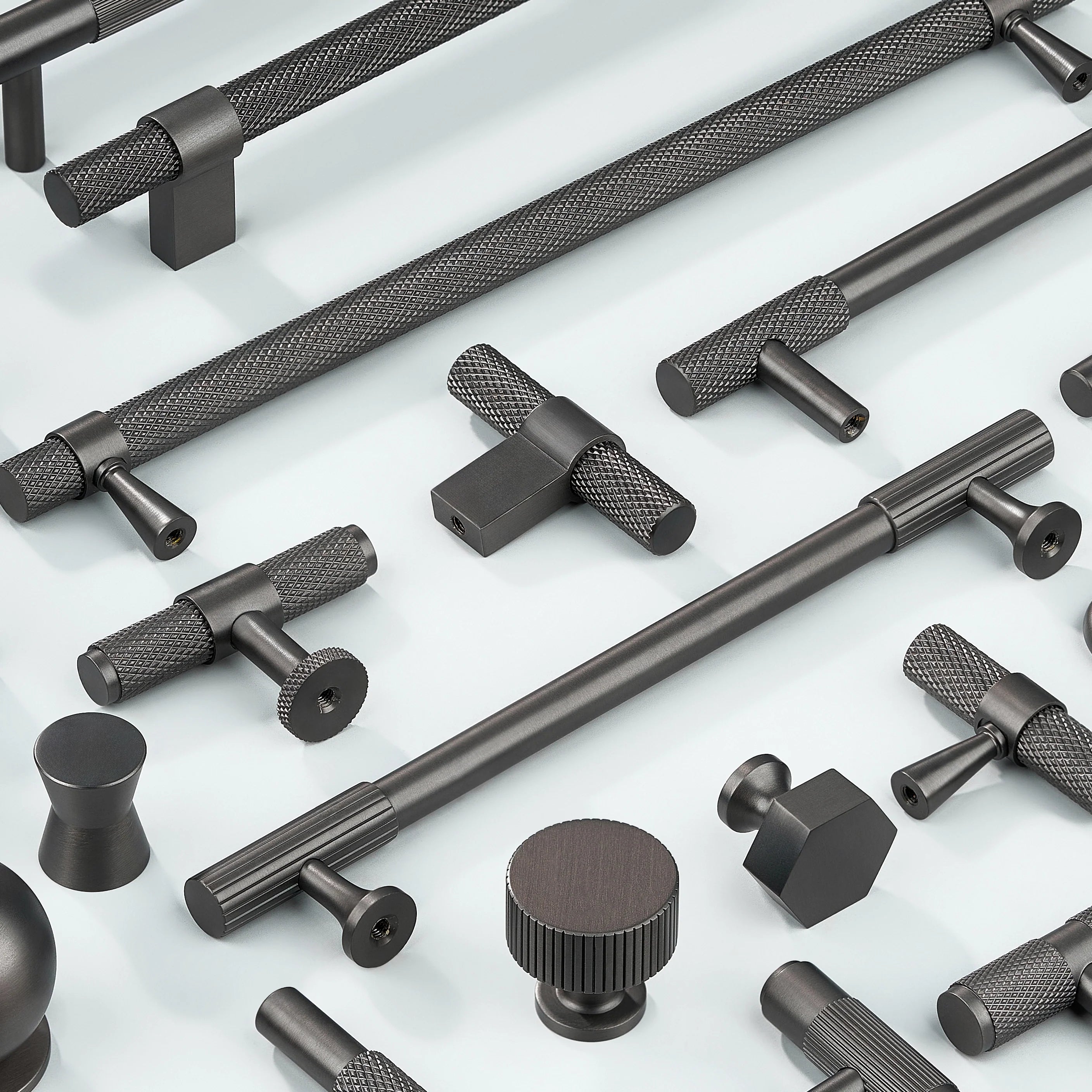 Cabinet Handles in diamond knurling, linear knurling, curve shape without knurling in gold finish. Cabinet Knobs in knurling, linear knurling, cylindrical shape, hexagonal shape, sphere shape, T shape in gunmetal finish