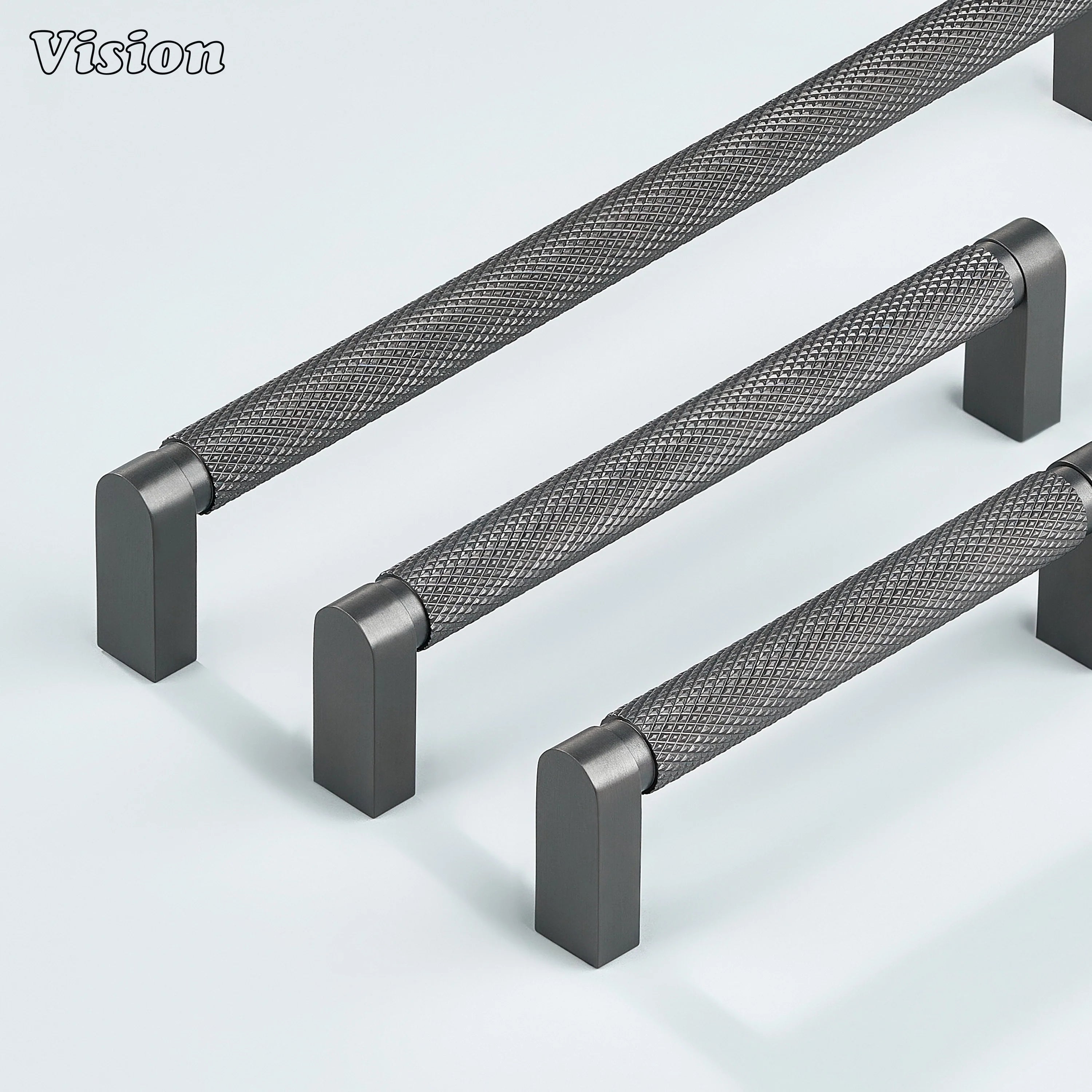 Gunmetal ripple knurled cabinet handle mounted on dresser drawers.