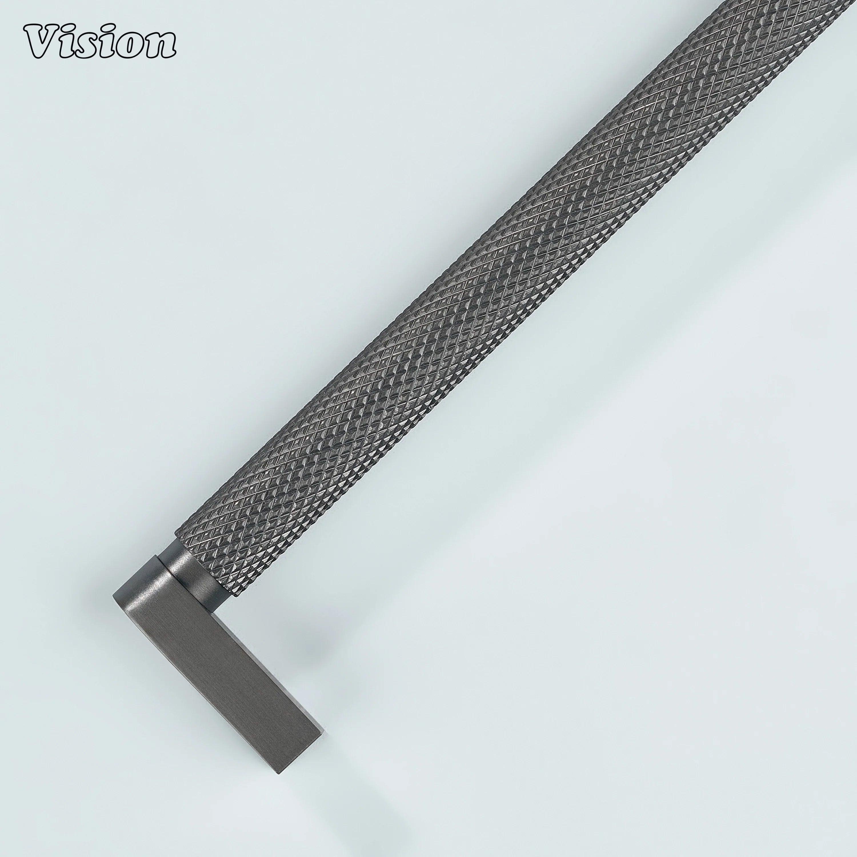 Gunmetal ripple knurled cabinet handle installed on vanity drawers.