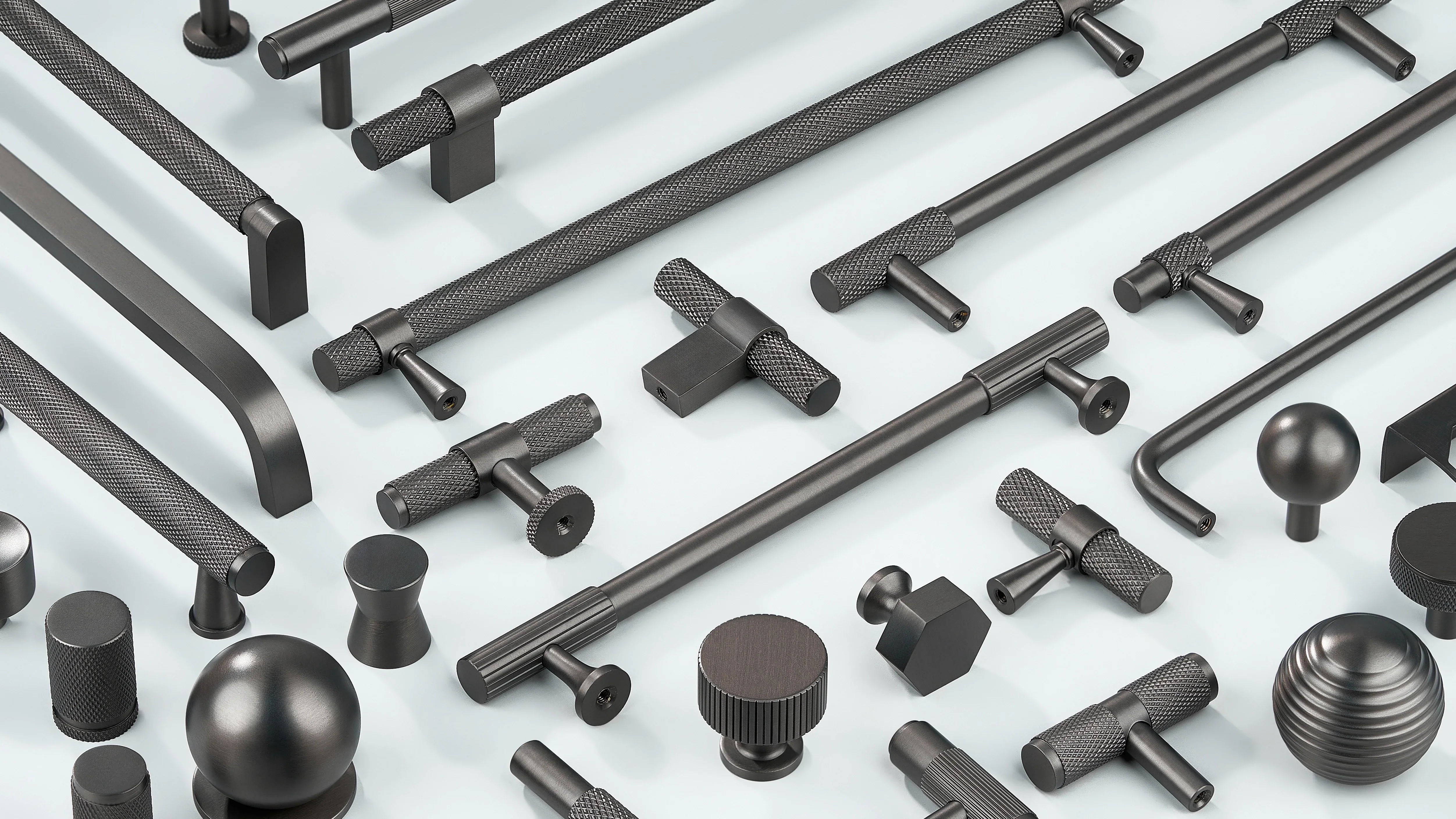 Cabinet handles in diamond knurling, linear knurling and curve shape along with Cabinet Knobs in T shape, sphere shape, round shape, hexagonal design and drum-like shape in gunmetal finish