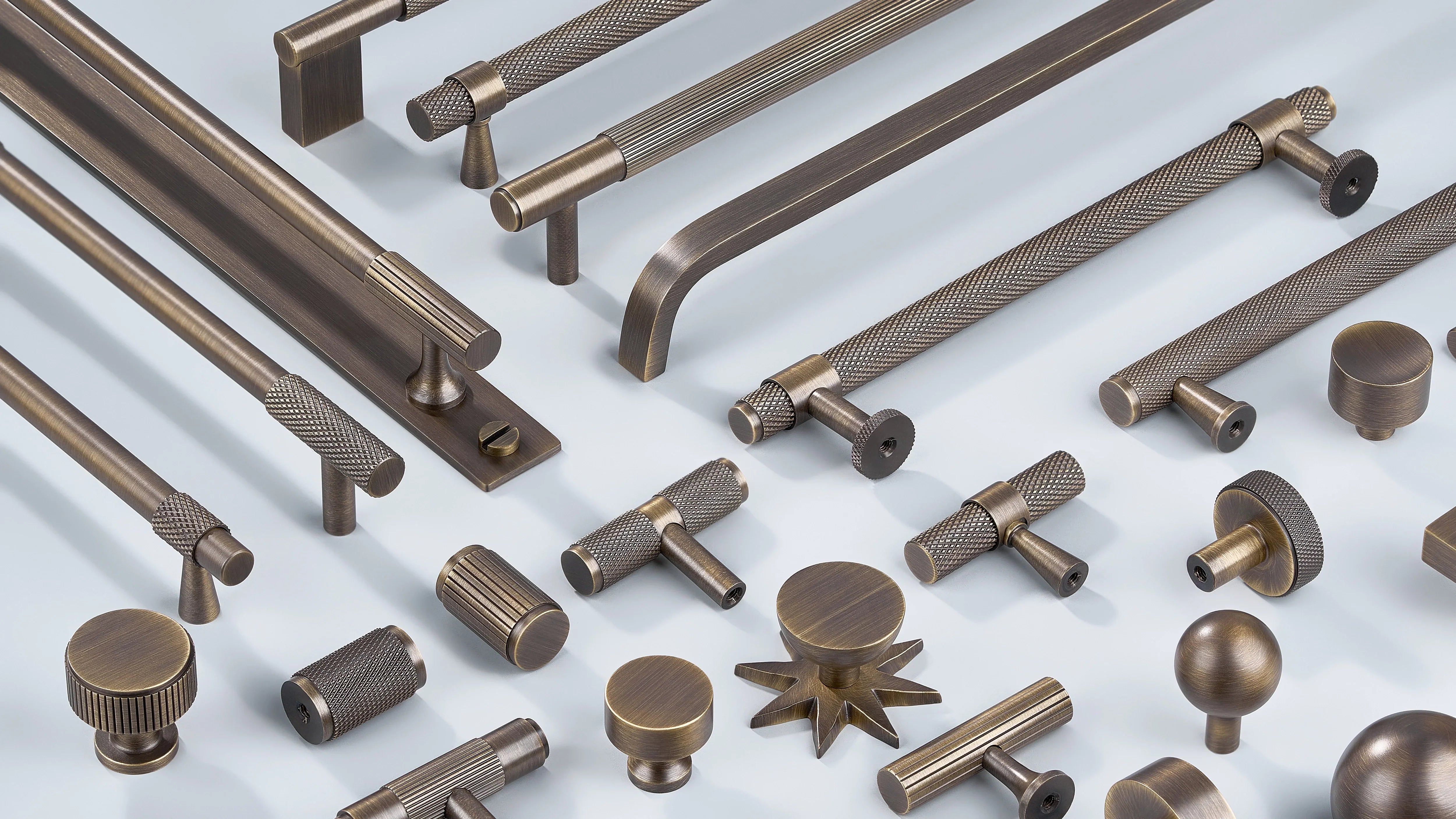 Cabinet Handle in diamond knurling, linear knurling and curve design along with cabinet knobs in round shape, T shape sphere shape in antique bronze
