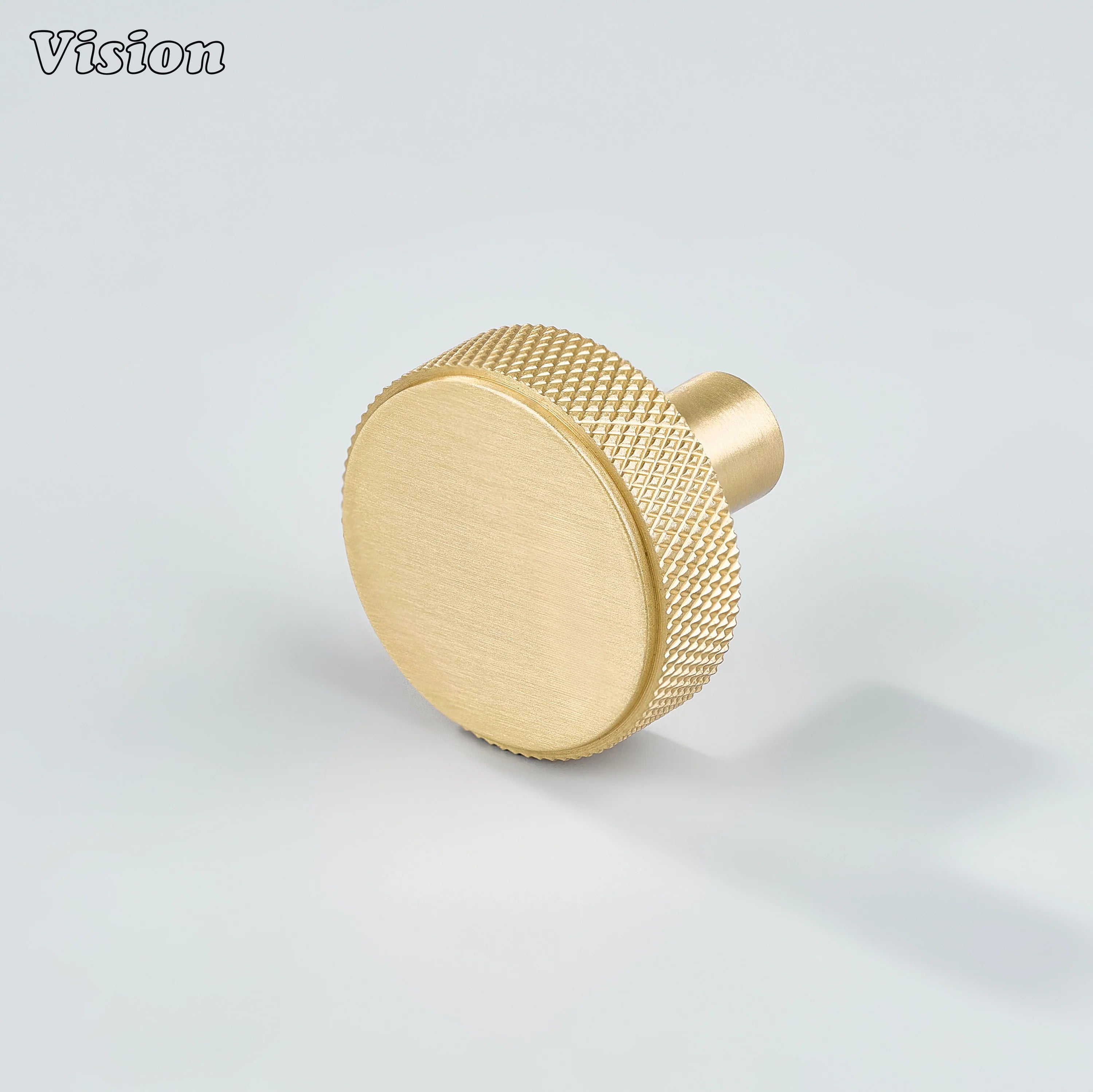 Gold cabinet knob with round knurled profile and cylindrical leg for kitchen cabinets