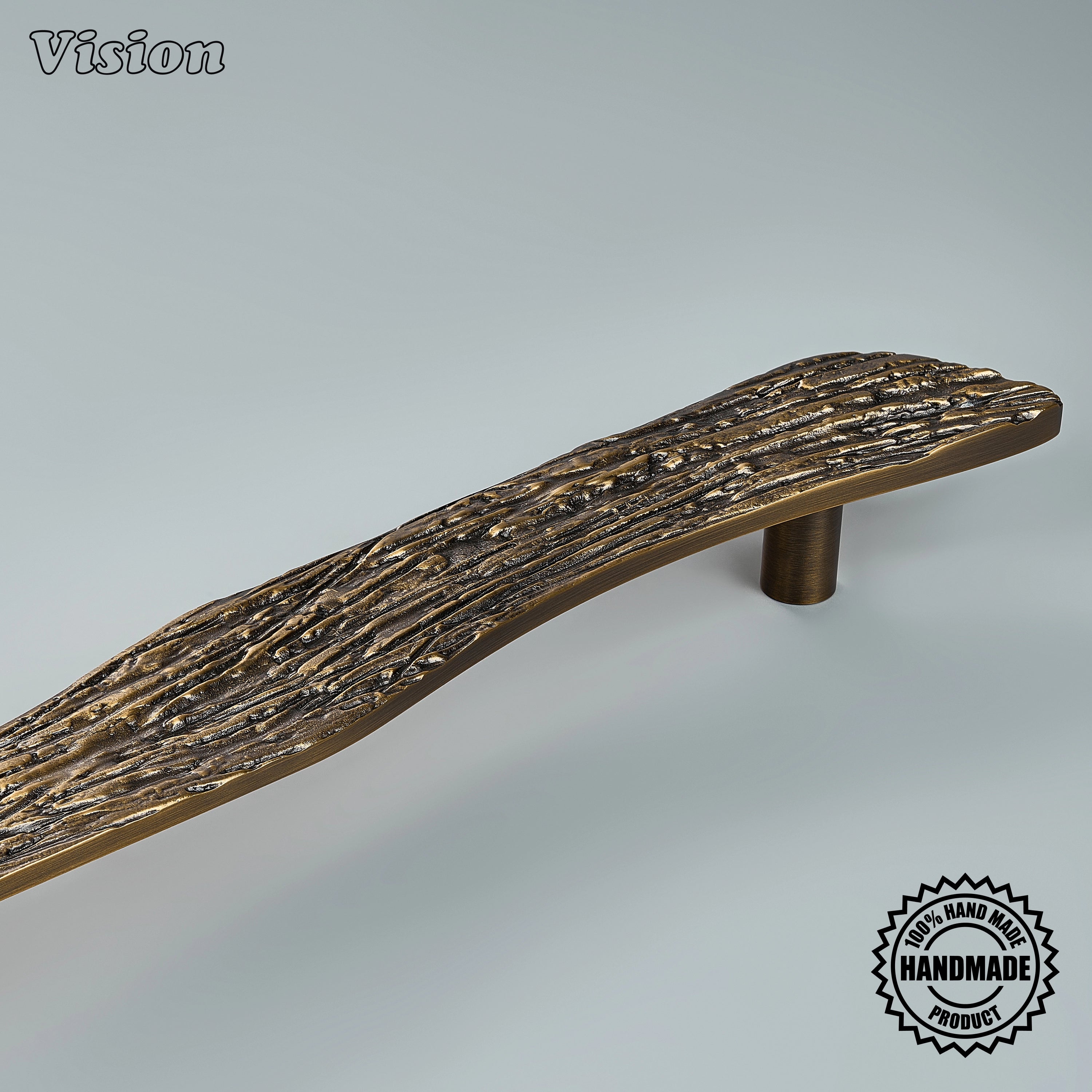 Handcrafted antique bronze appliance pull with sweeping grooved relief on architectural doors