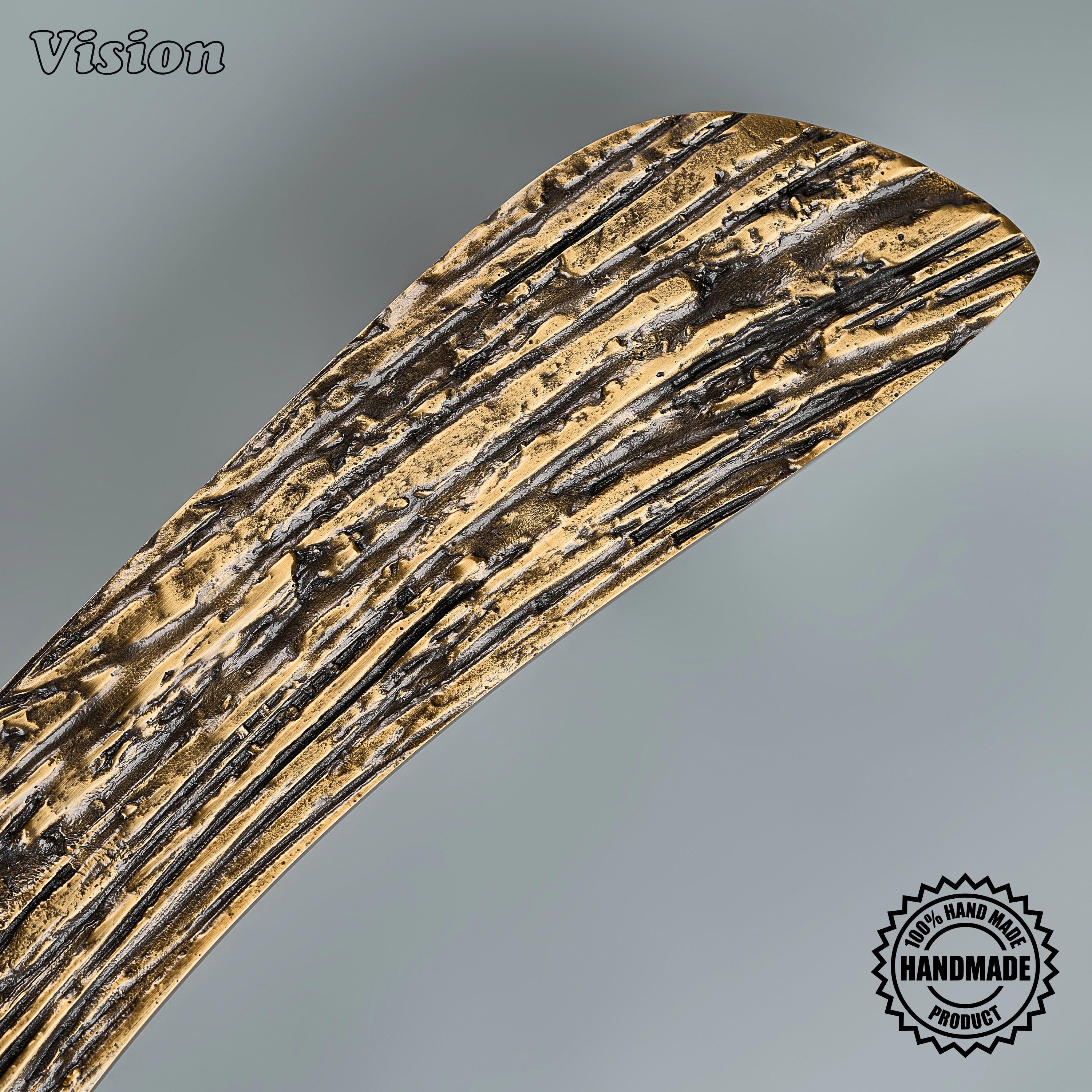 Antique bronze appliance pull featuring a handcrafted tactile carved surface for statement armoires