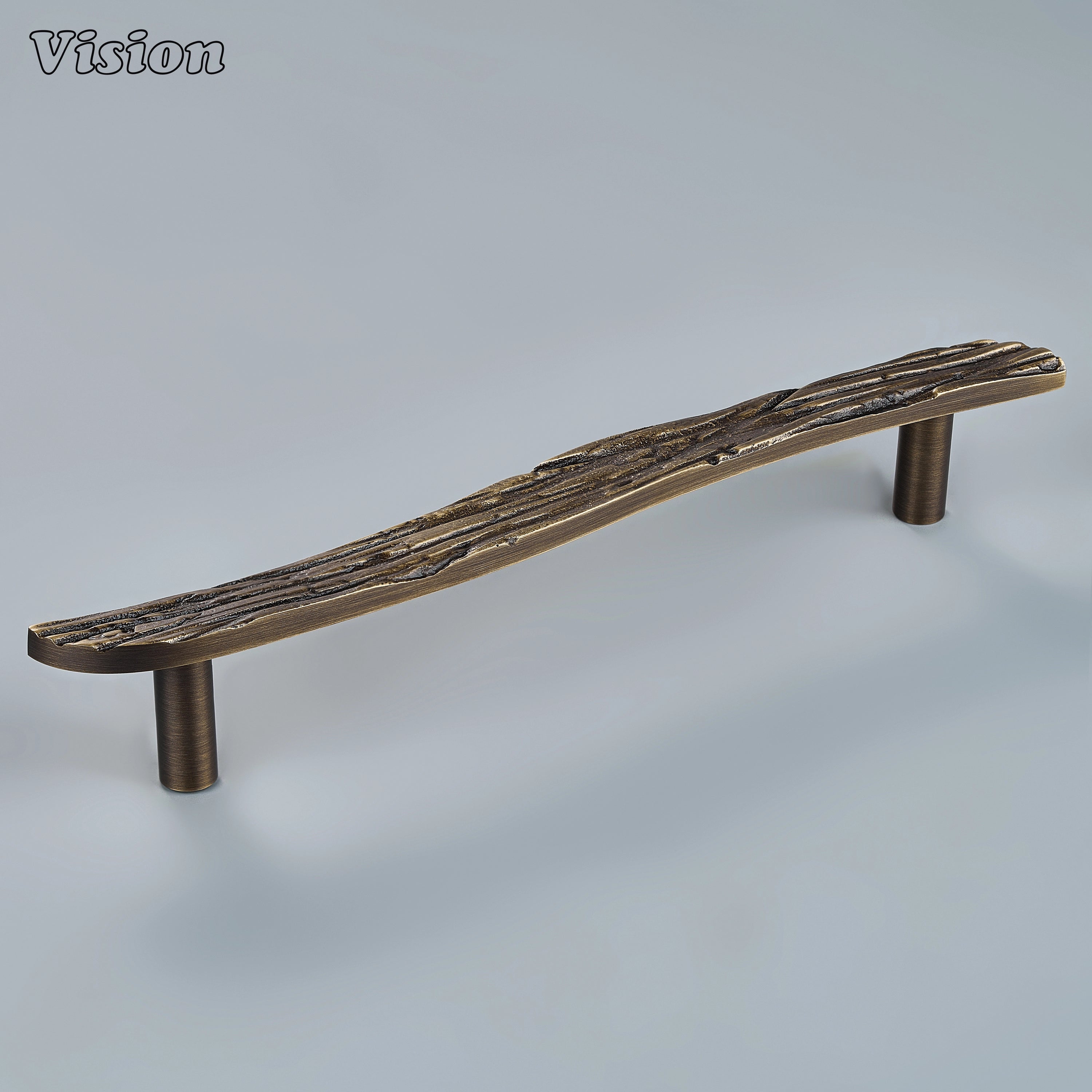 Sculpted antique bronze cabinet handle with sweeping organic curves on modern statement drawers