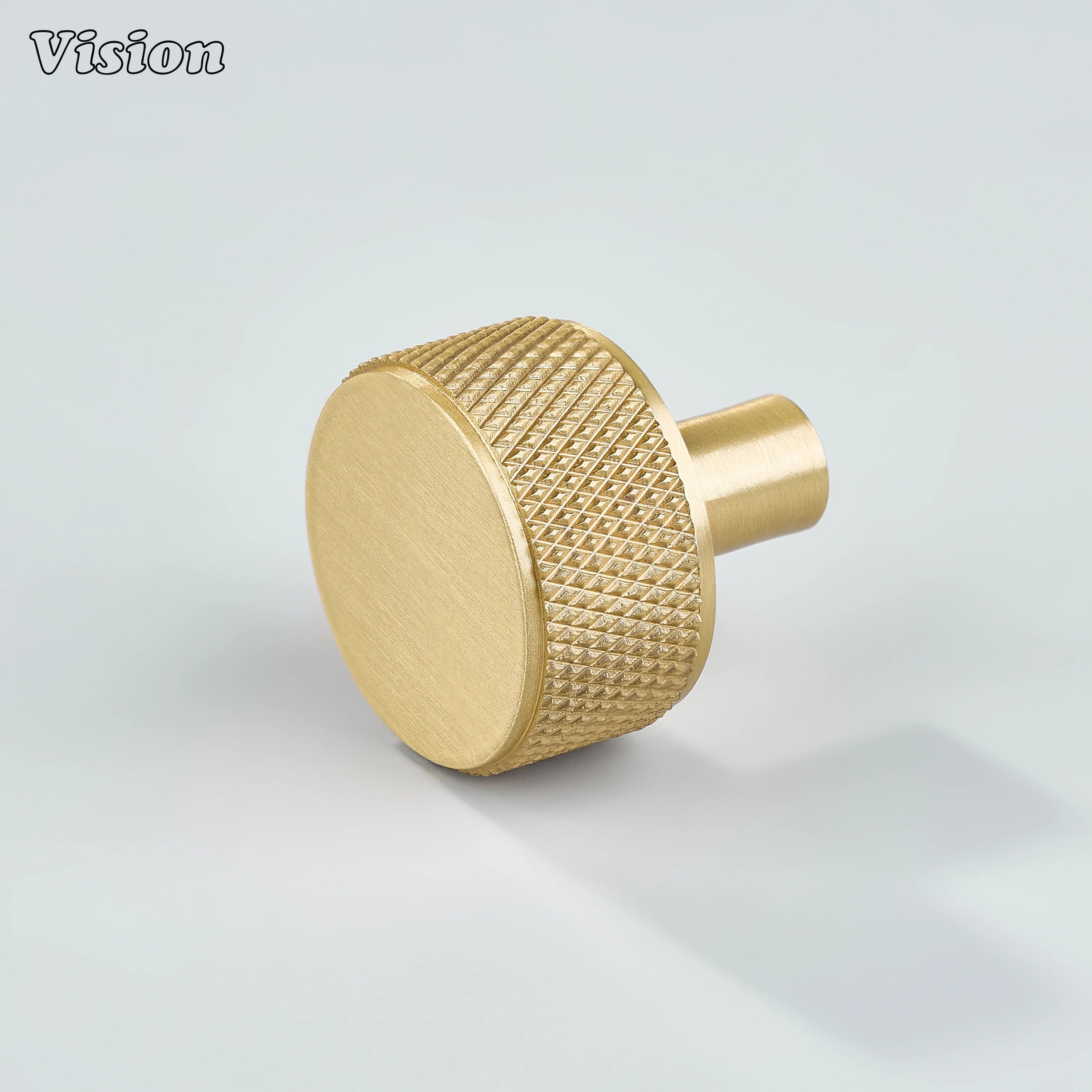 Gold cabinet knob with round knurled grip and cylinder leg for modern kitchen cabinets