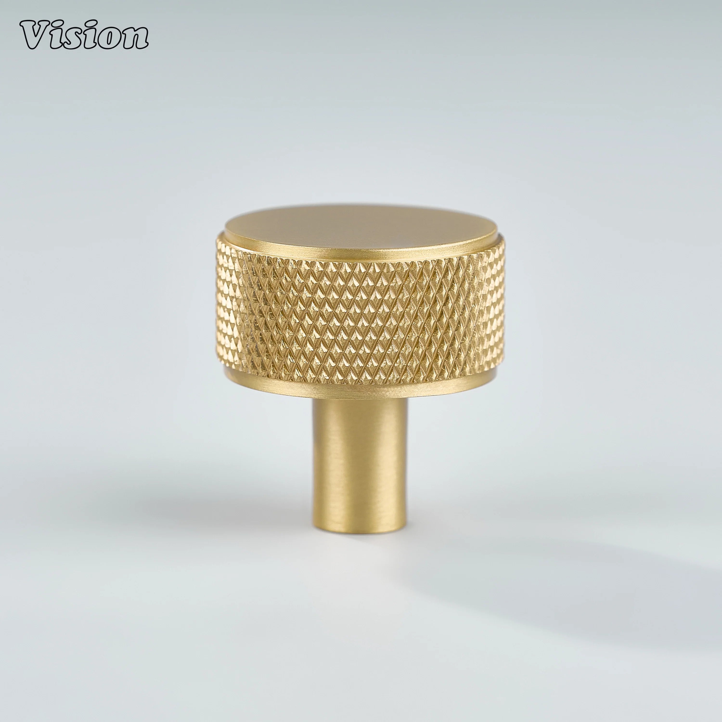Gold cabinet knob with round knurled grip and cylinder leg for modern kitchen cabinets