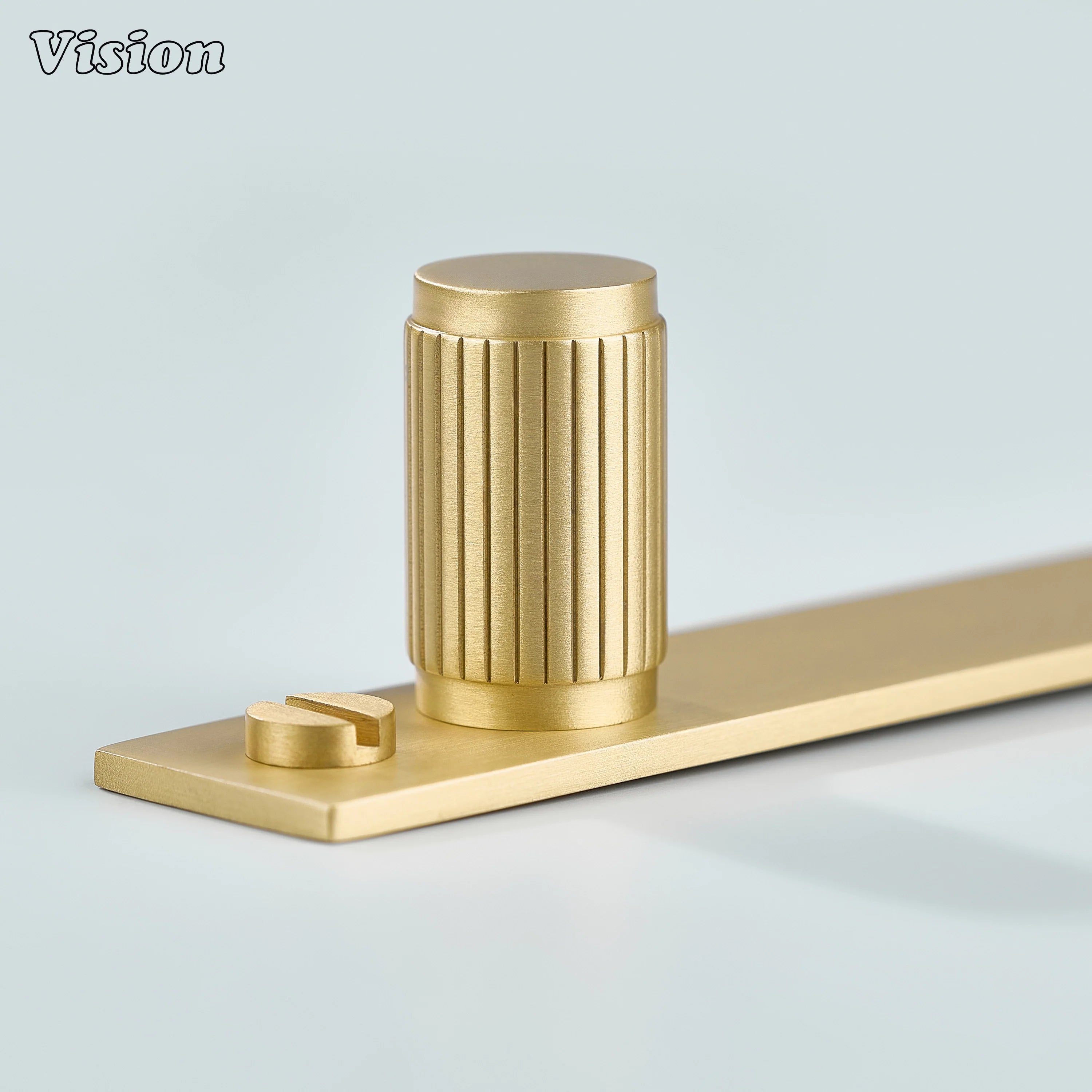 Linear knurled Gold cabinet knob featuring cylindrical brass knob on backplate for wardrobes