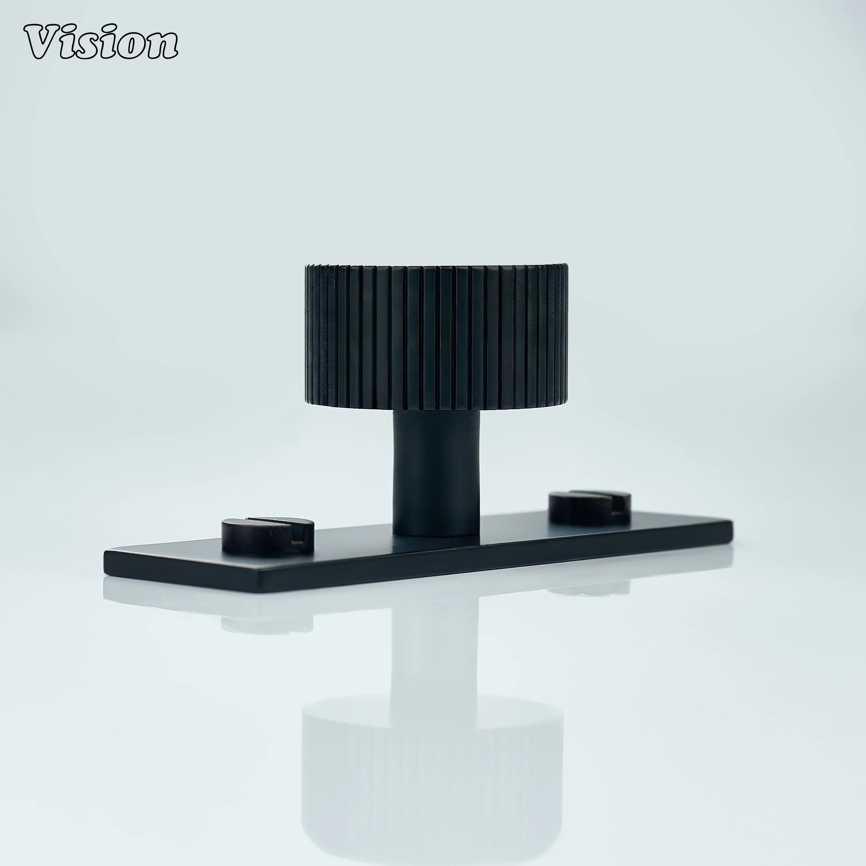 Black cabinet knob with knurled round profile on backplate for drawers