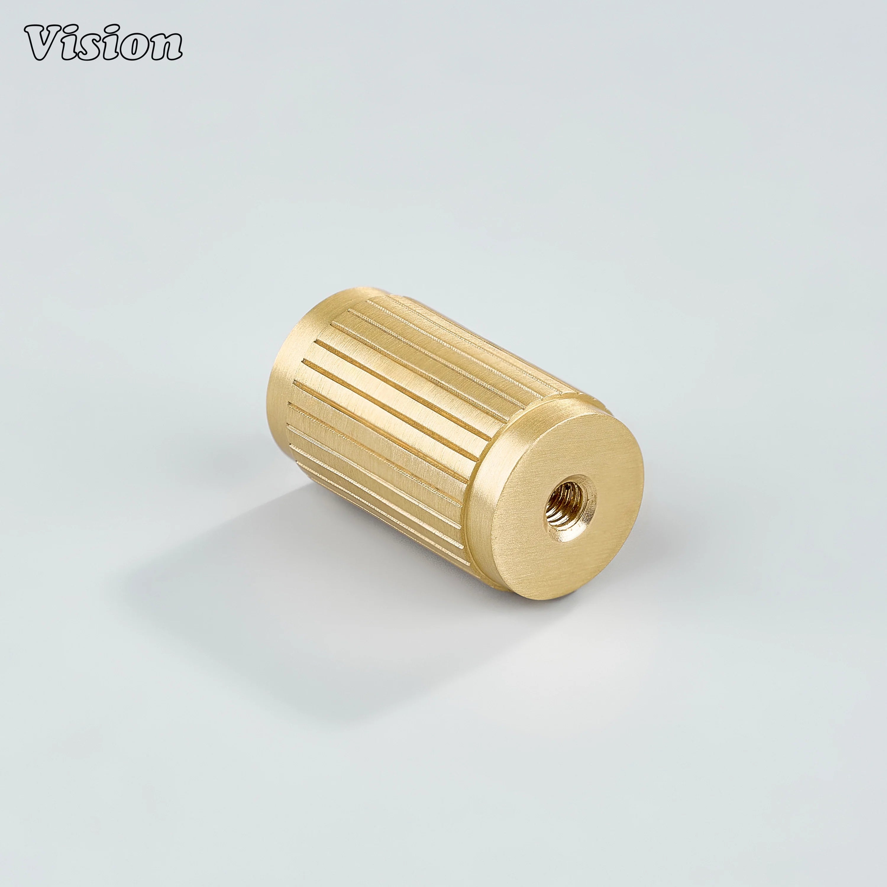 Gold brass cylinder cabinet knob with linear profile for contemporary drawers