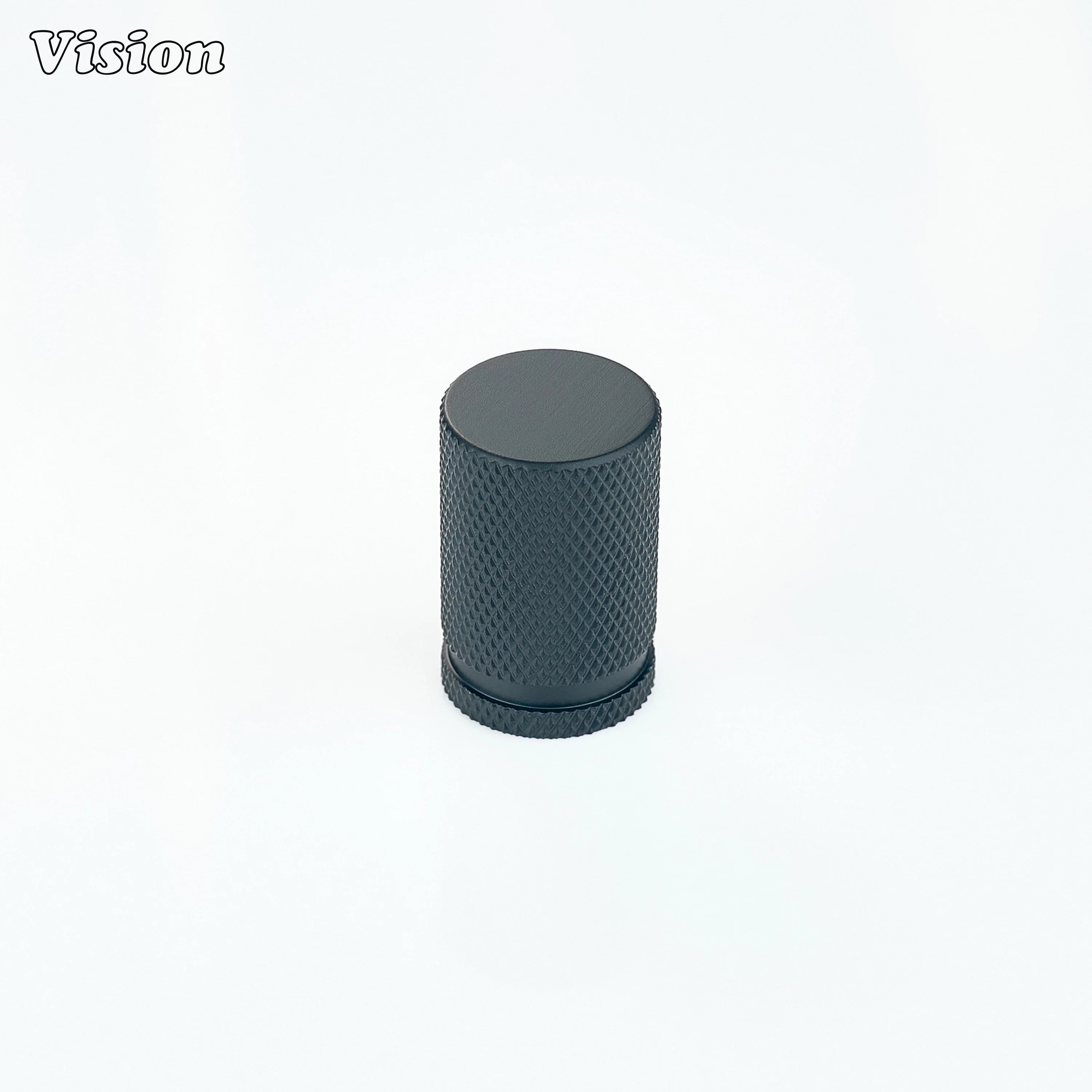 Black brass cabinet knob with detailed knurled surface and round cylinder shape for drawers