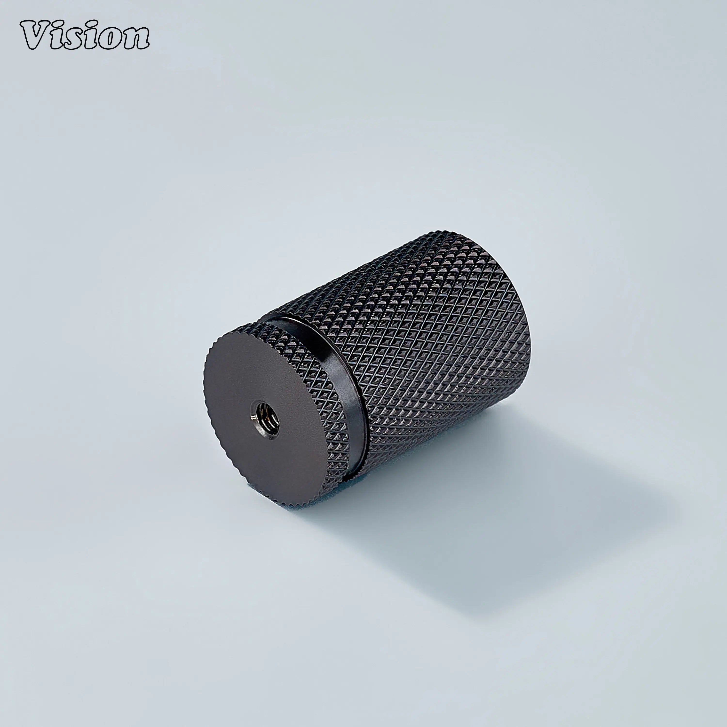 Modern brass knurled cylinder cabinet knob in bronze finish used for vanity units.