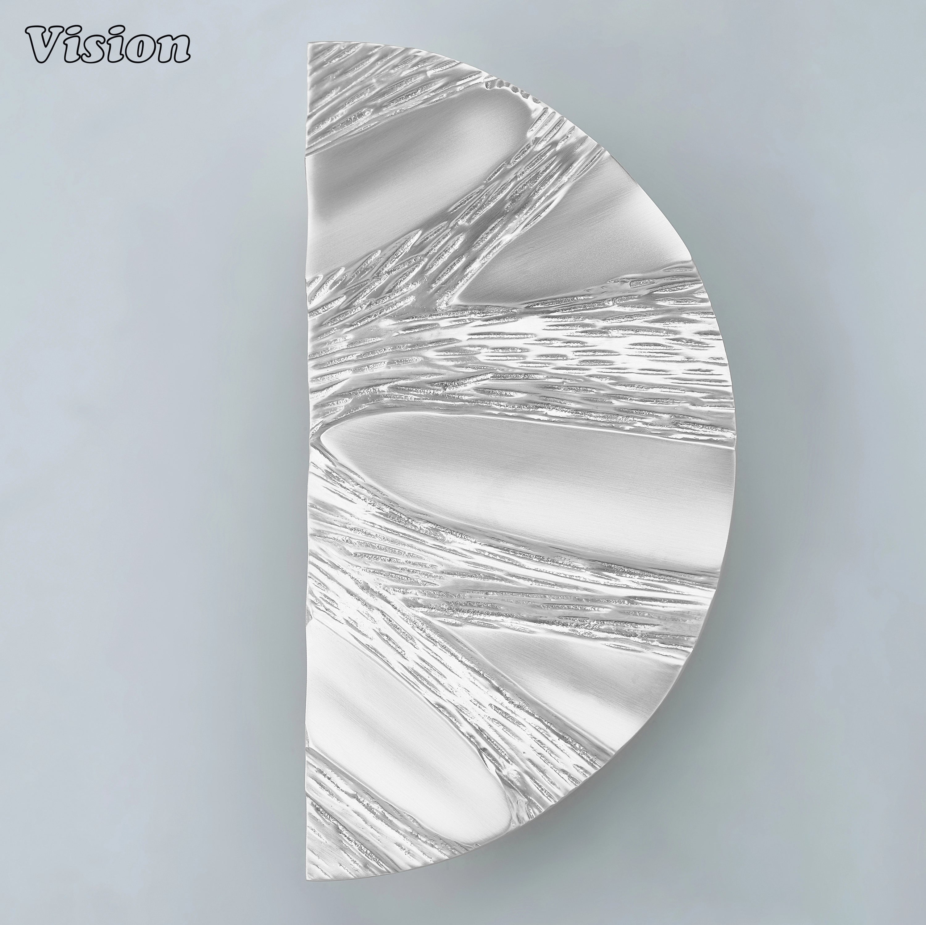 Silver handcrafted entrance pull with artistic organic surface for upscale projects.