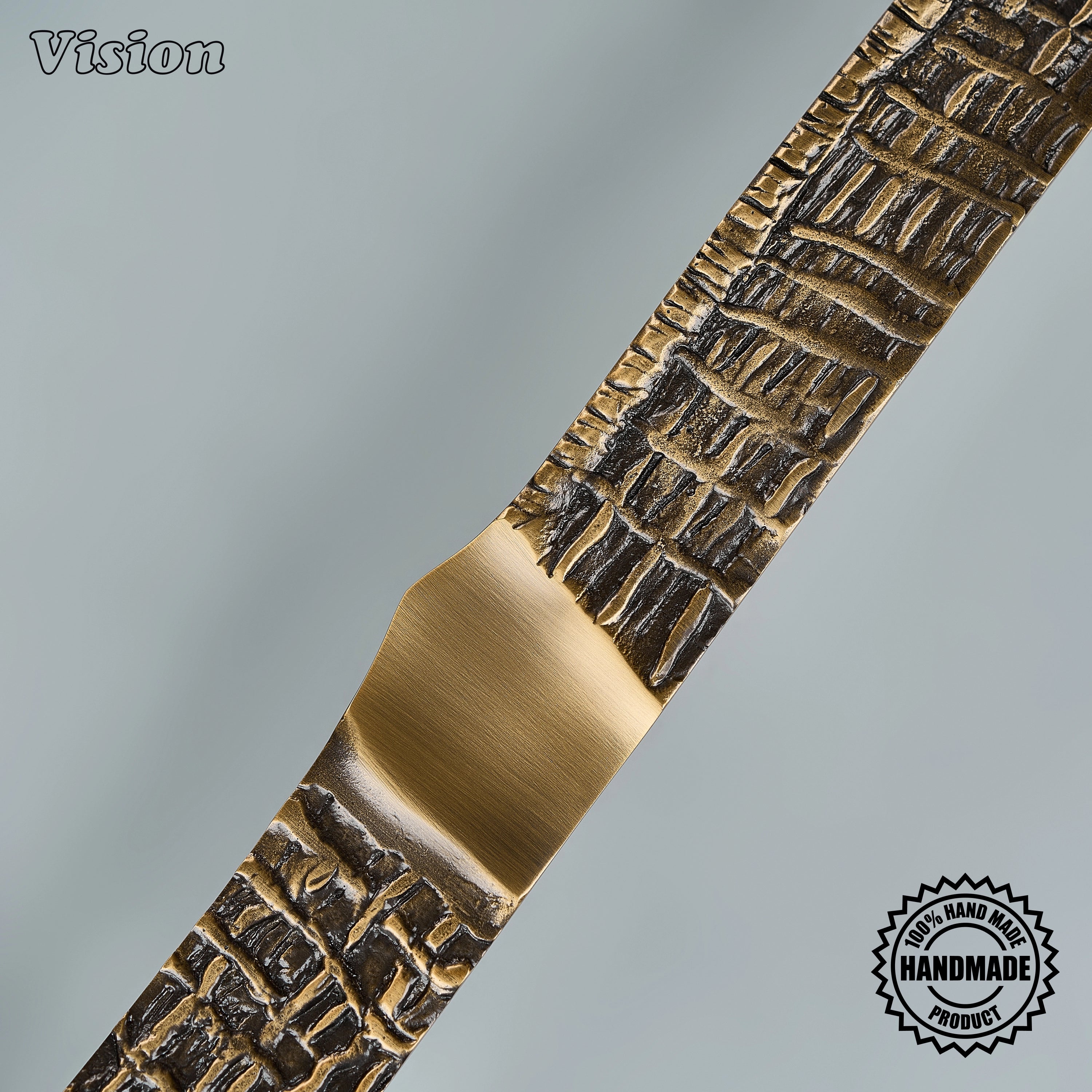 Antique bronze appliance pull featuring a handcrafted tactile woven surface for luxury armoires