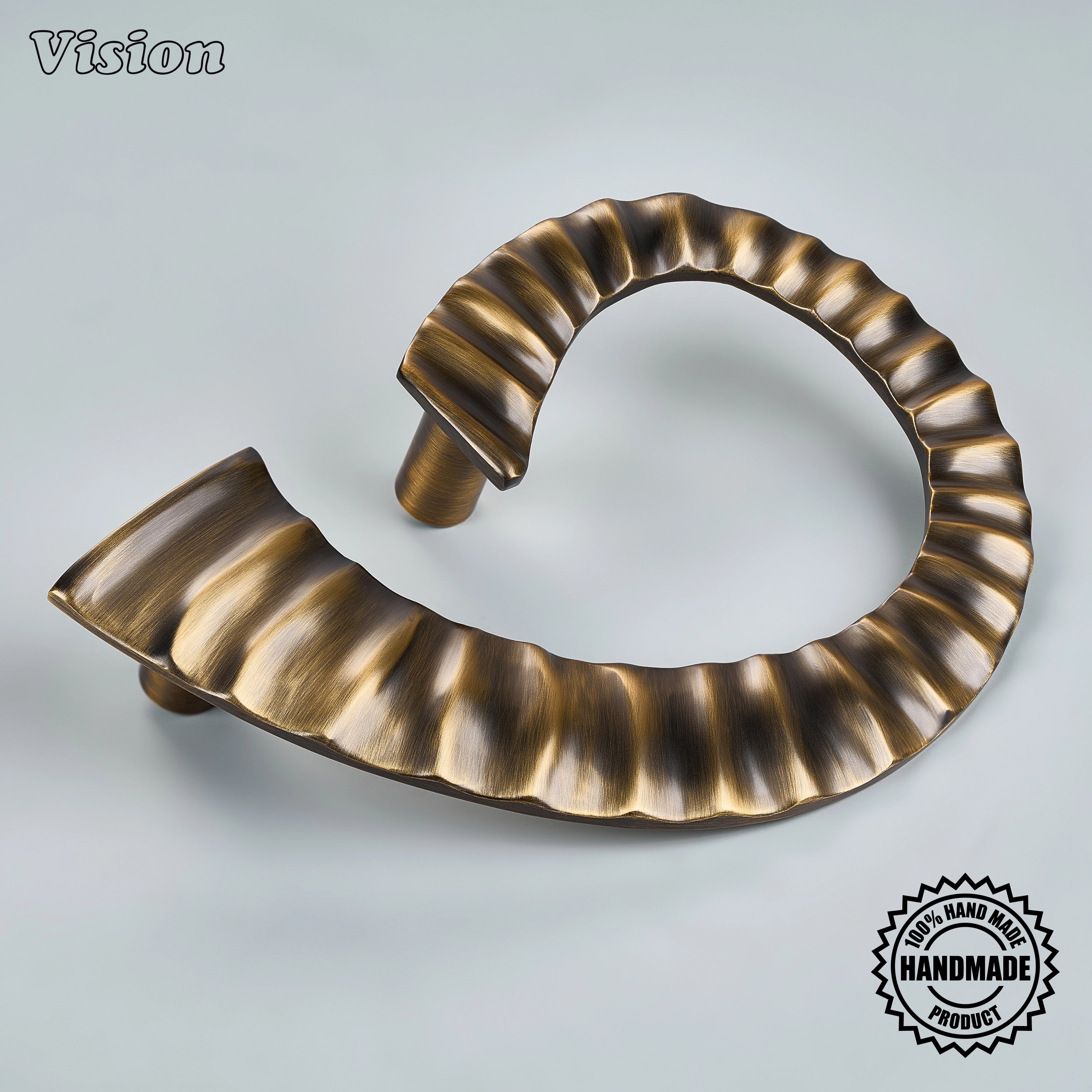 Antique Bronze handcrafted door handle with a sculptural ridged profile and cylindrical mounting legs for grand entry doors.