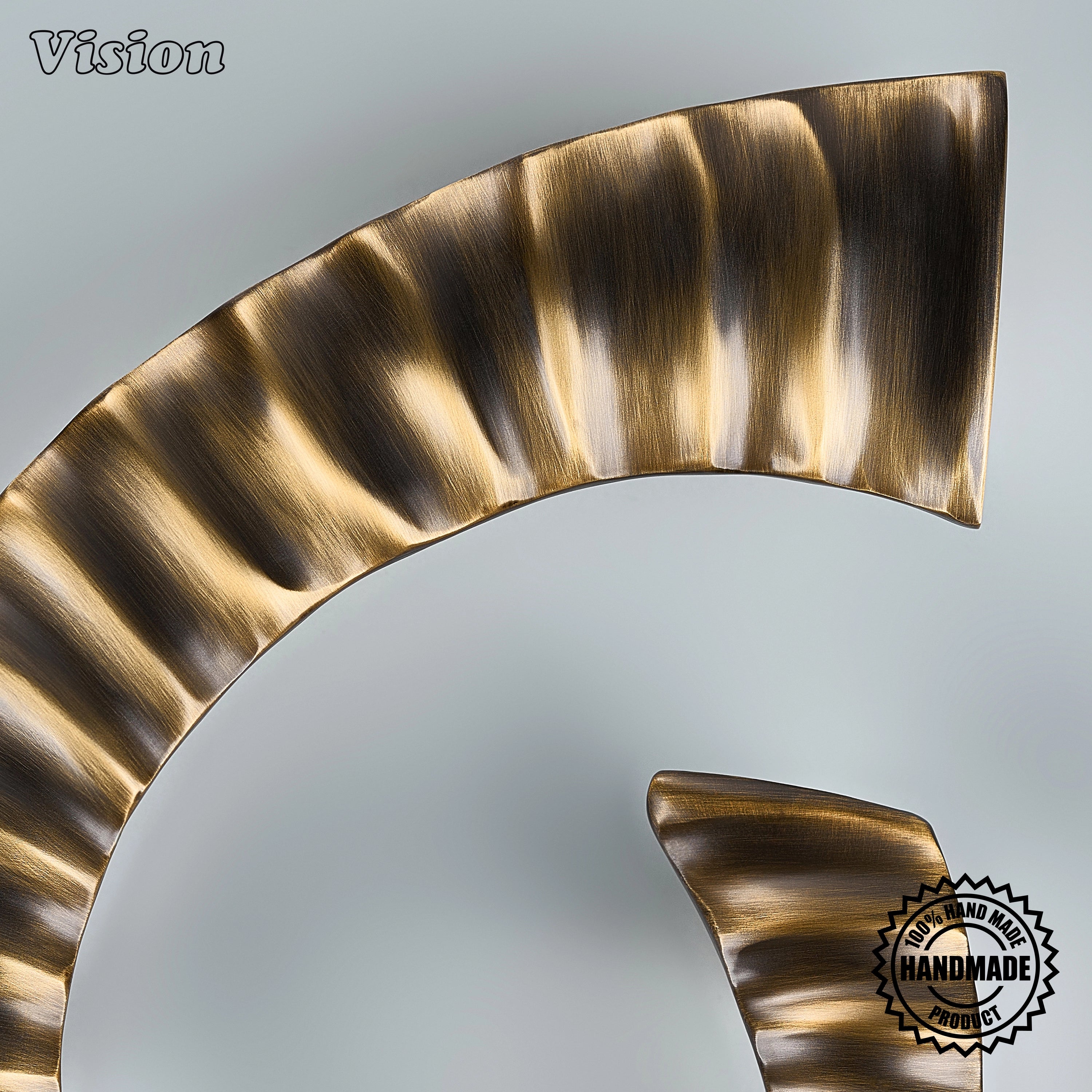 Antique Bronze sculptural handcrafted door handle with curved ridges and cylindrical end mounts for boutique hotel doors.