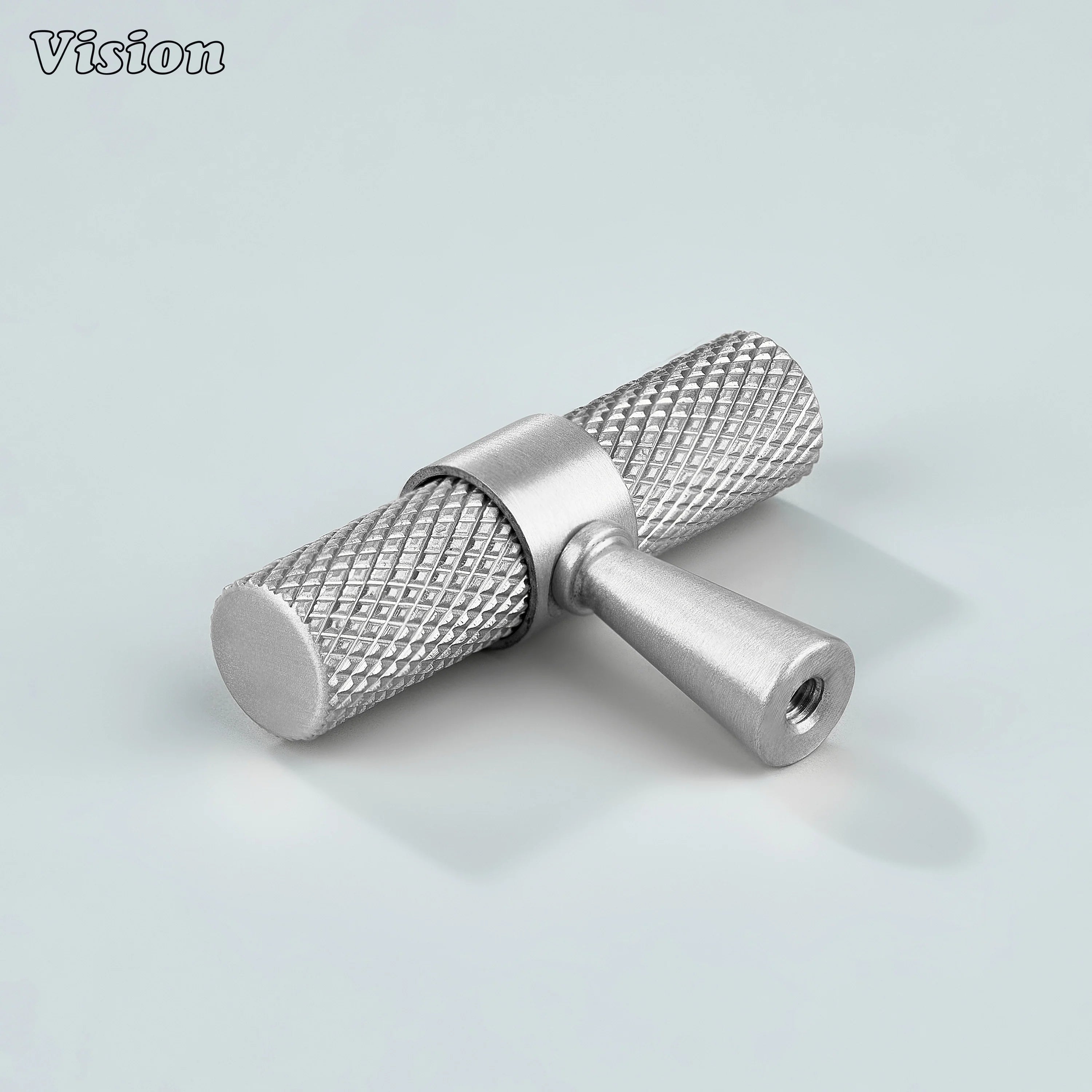 Modern silver knurled T-knob used for cupboards and furniture.