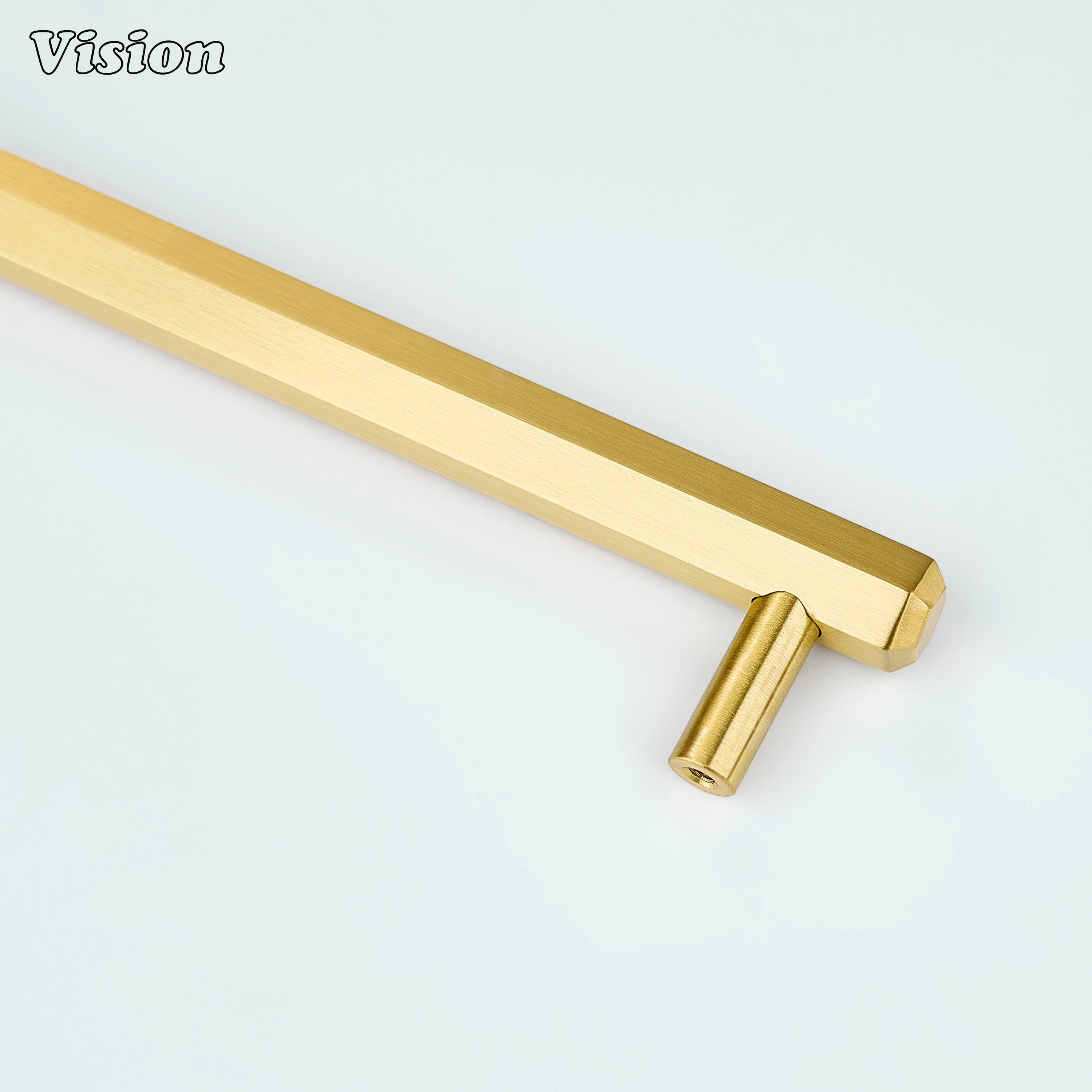 Gold cabinet handle showcasing a hexagonal bar profile with sturdy round legs for furniture