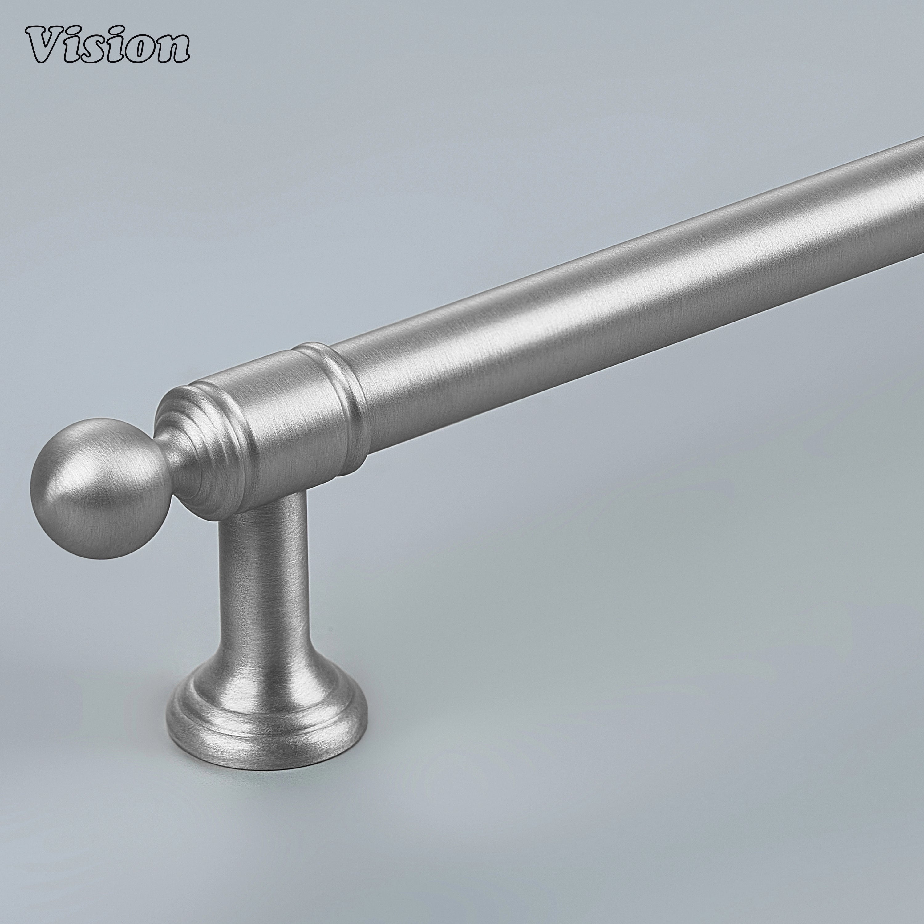 Silver solid brass cabinet pull with stepped geometric profile on modern kitchen cabinets