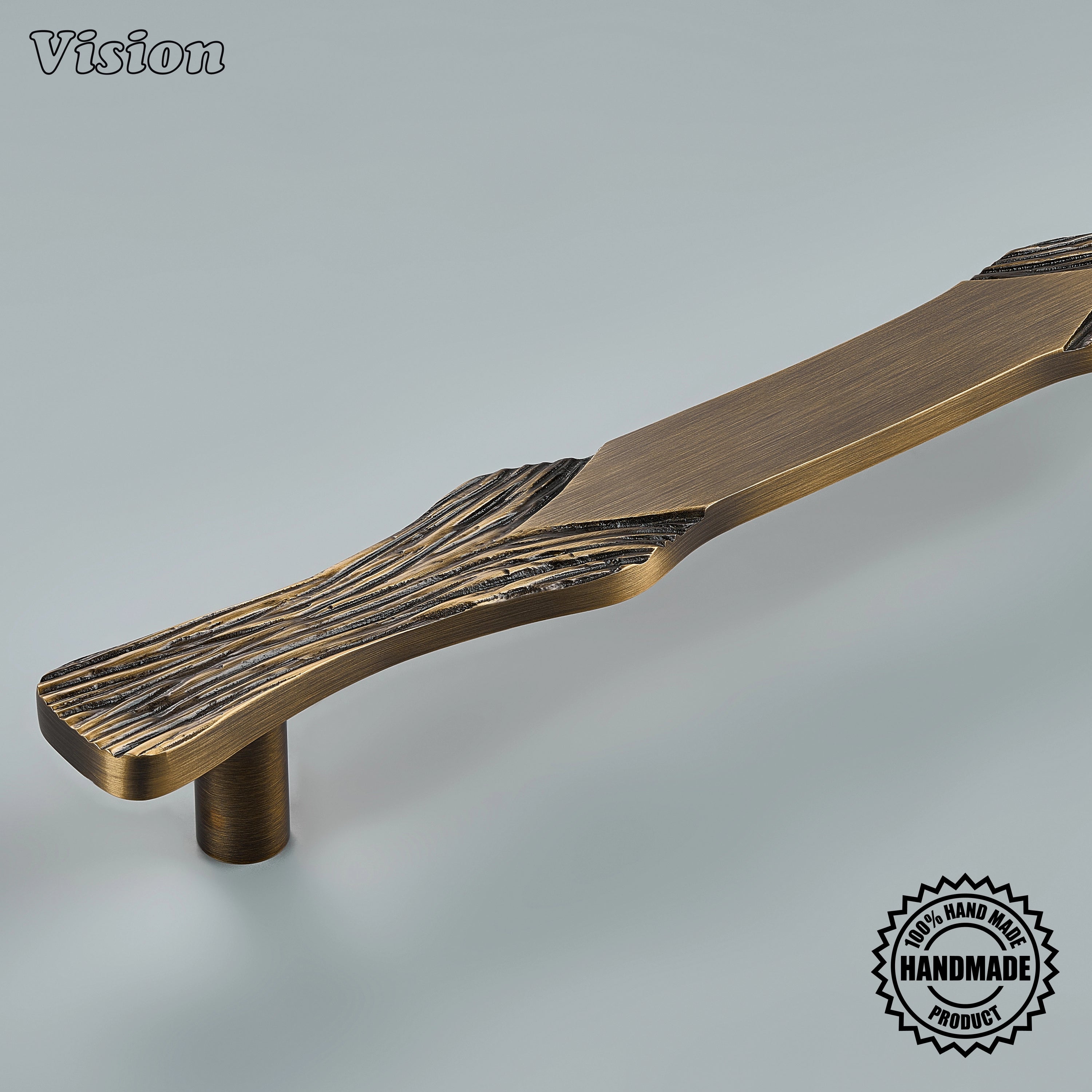 Antique Bronze solid brass appliance pull featuring organic carved texture for integrated refrigerator and pantry door hardware.