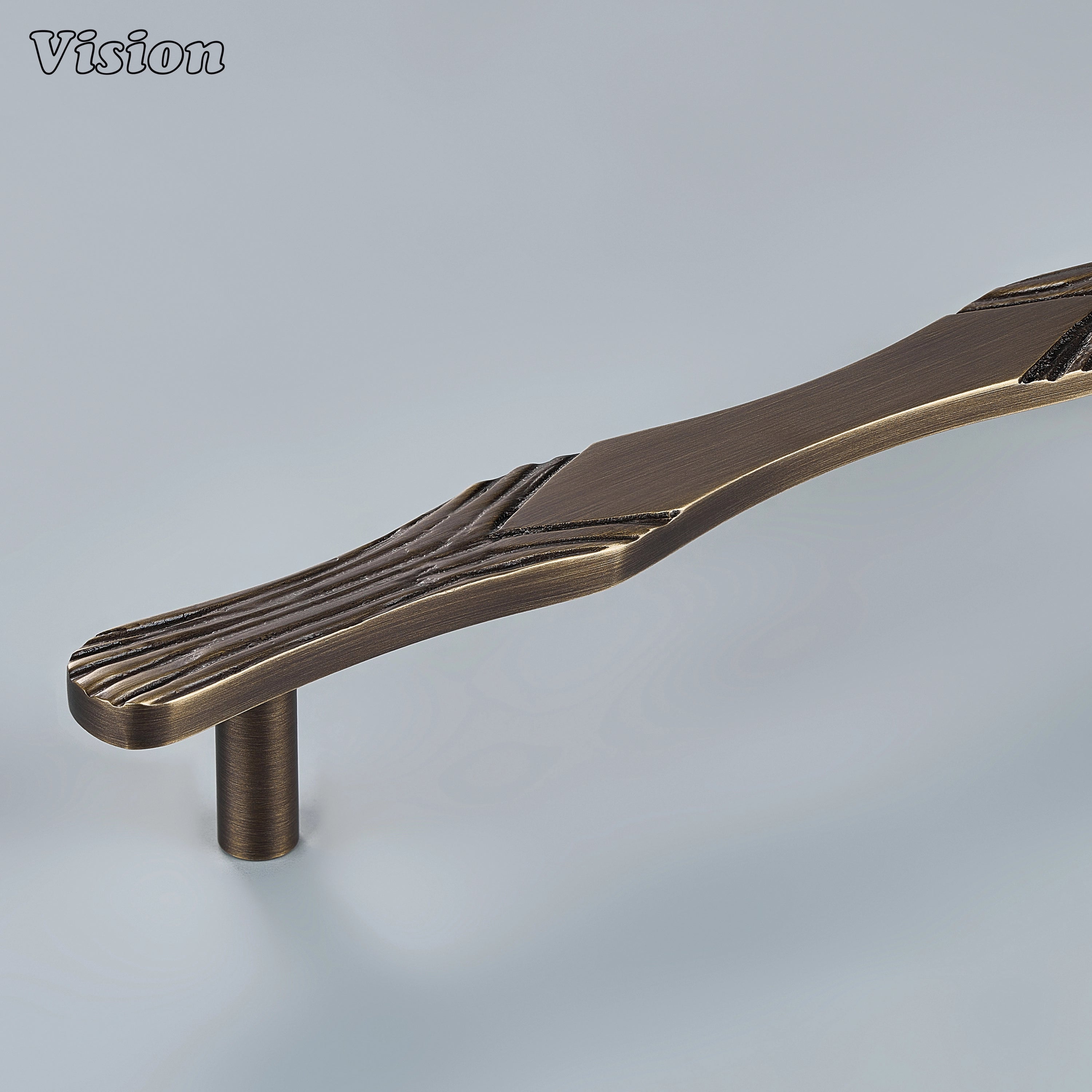 Antique Bronze handcrafted cabinet pull with carved driftwood profile and solid brass bar on kitchen cabinets
