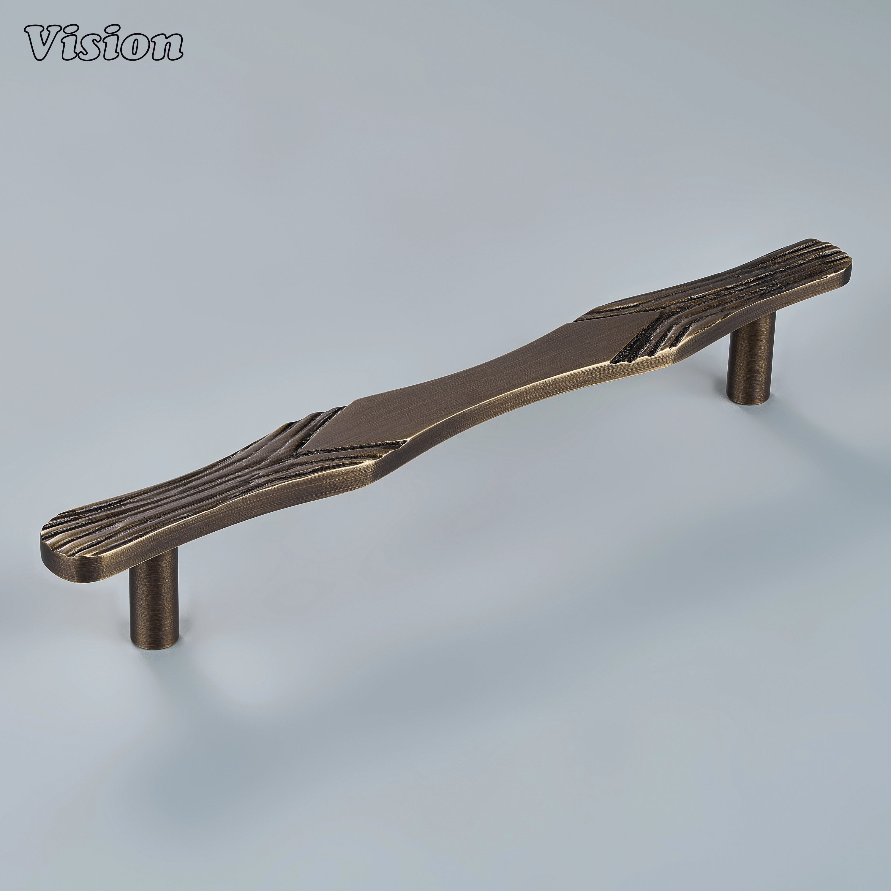 Sculpted antique bronze cabinet handle featuring organic carved texture on custom statement drawers
