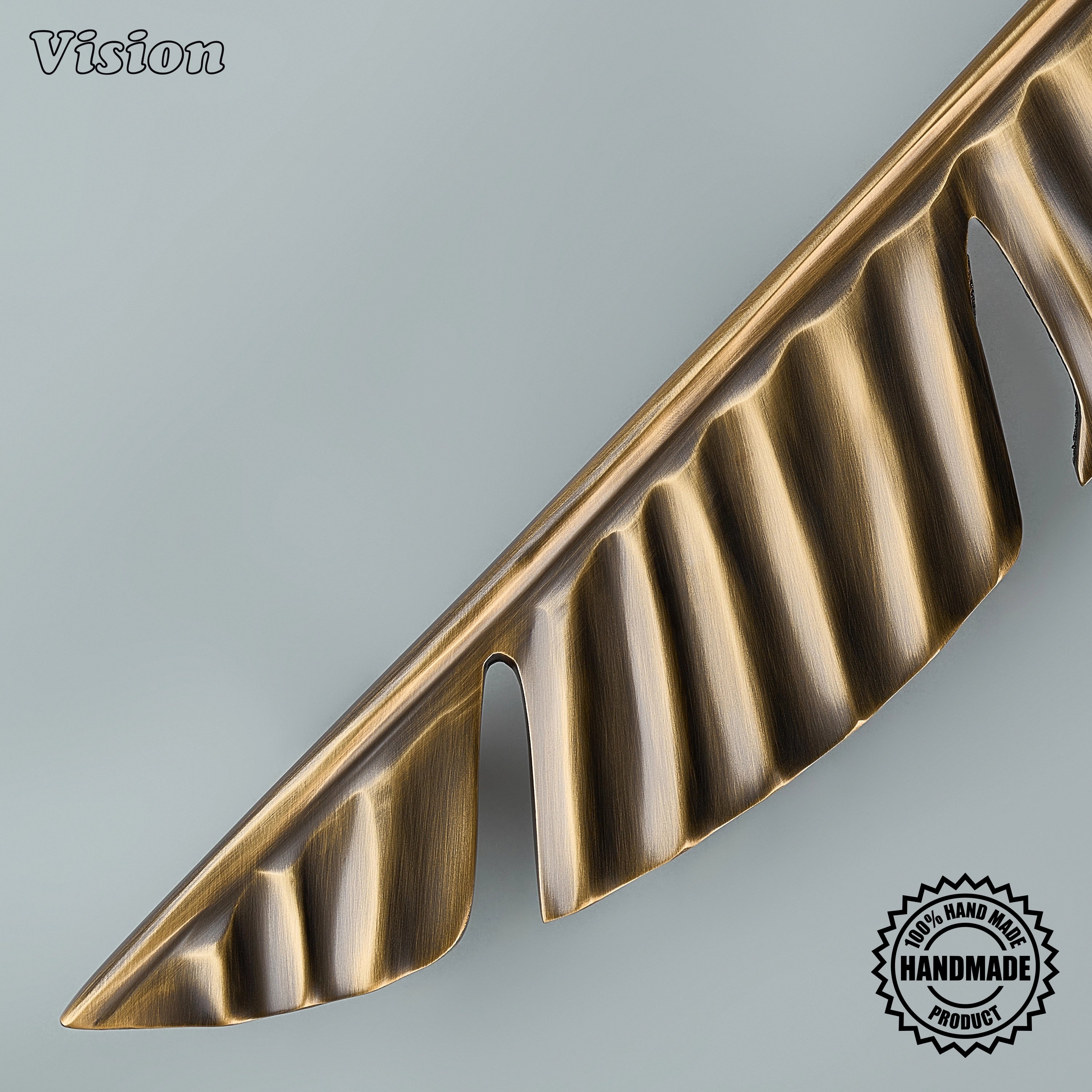 Antique Bronze cabinet handle with flowing sculpted texture for large kitchen drawers.