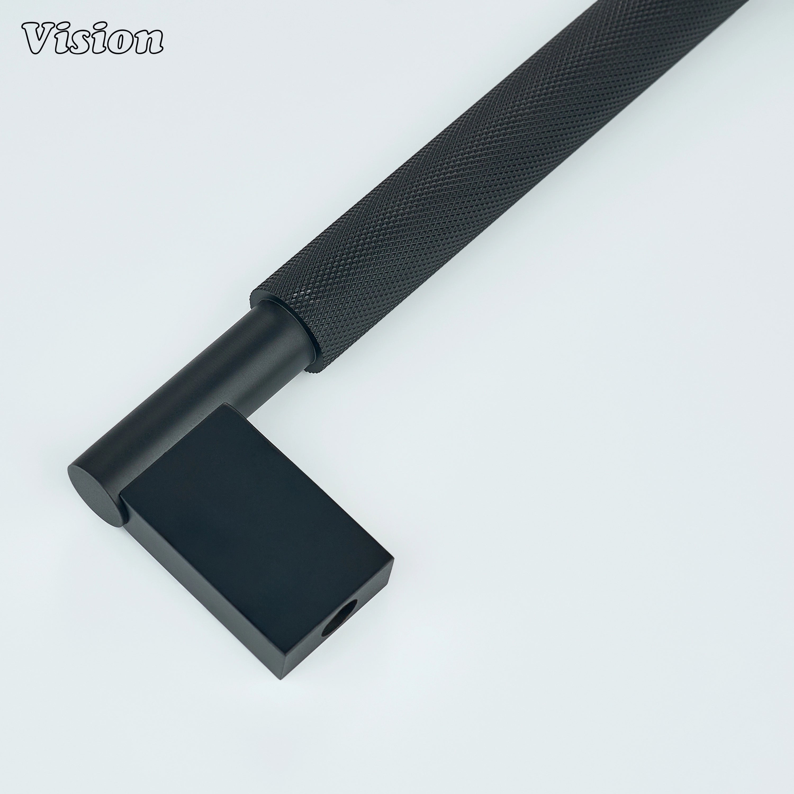 Black knurled brass appliance pull for integrated freezer drawers.