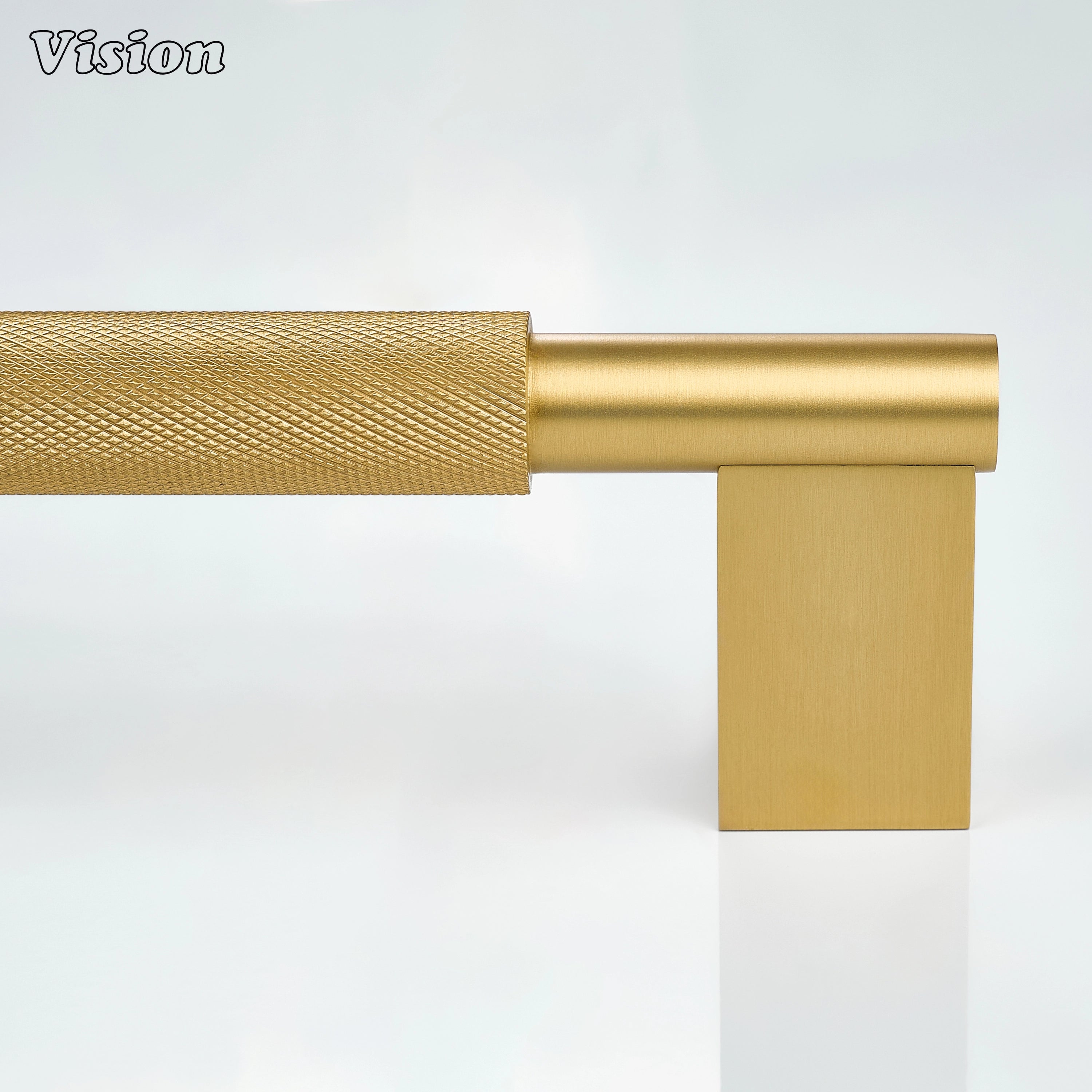 Gold appliance handle with textured grip and block supports for freezer drawers.