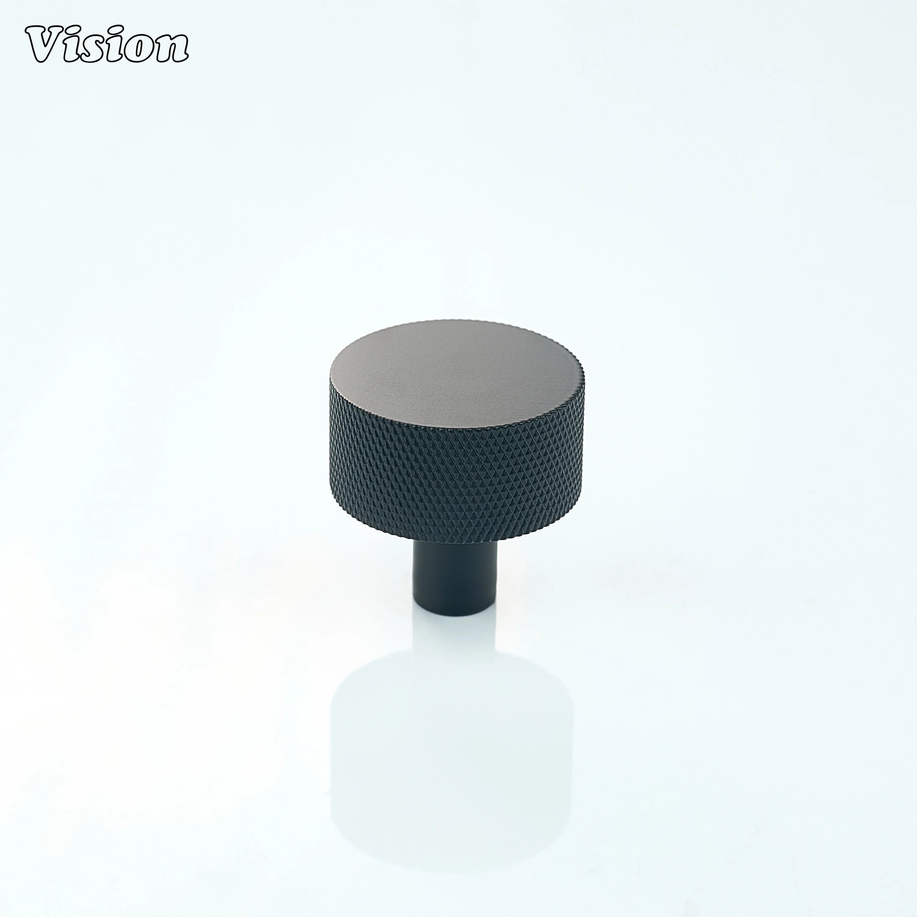 Round Black cabinet knob with grip detailing for wardrobe drawers