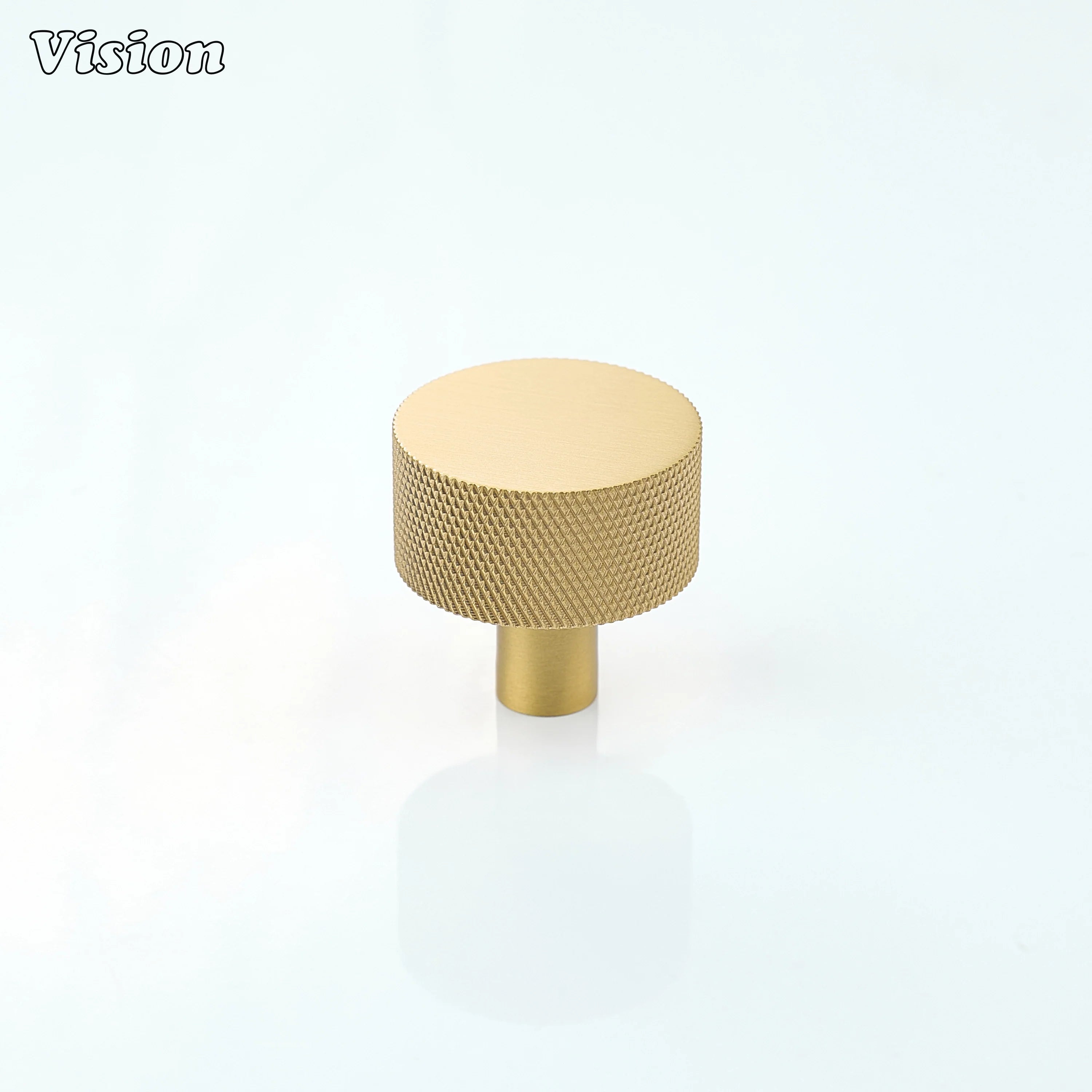 Round cabinet knob in Gold finish with textured grip design for wardrobe doors