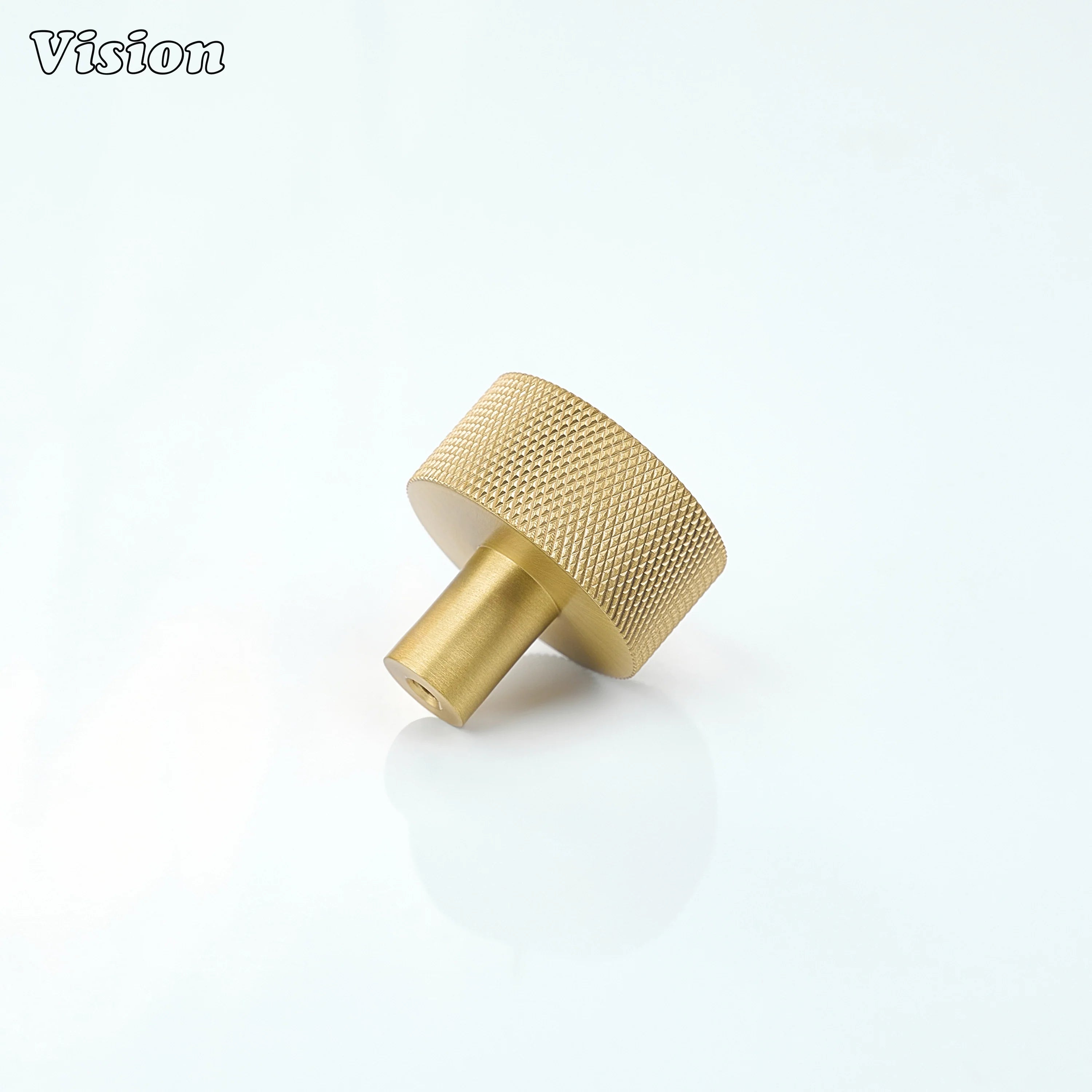 Gold round cabinet knob with textured grip pattern for wardrobe storage units