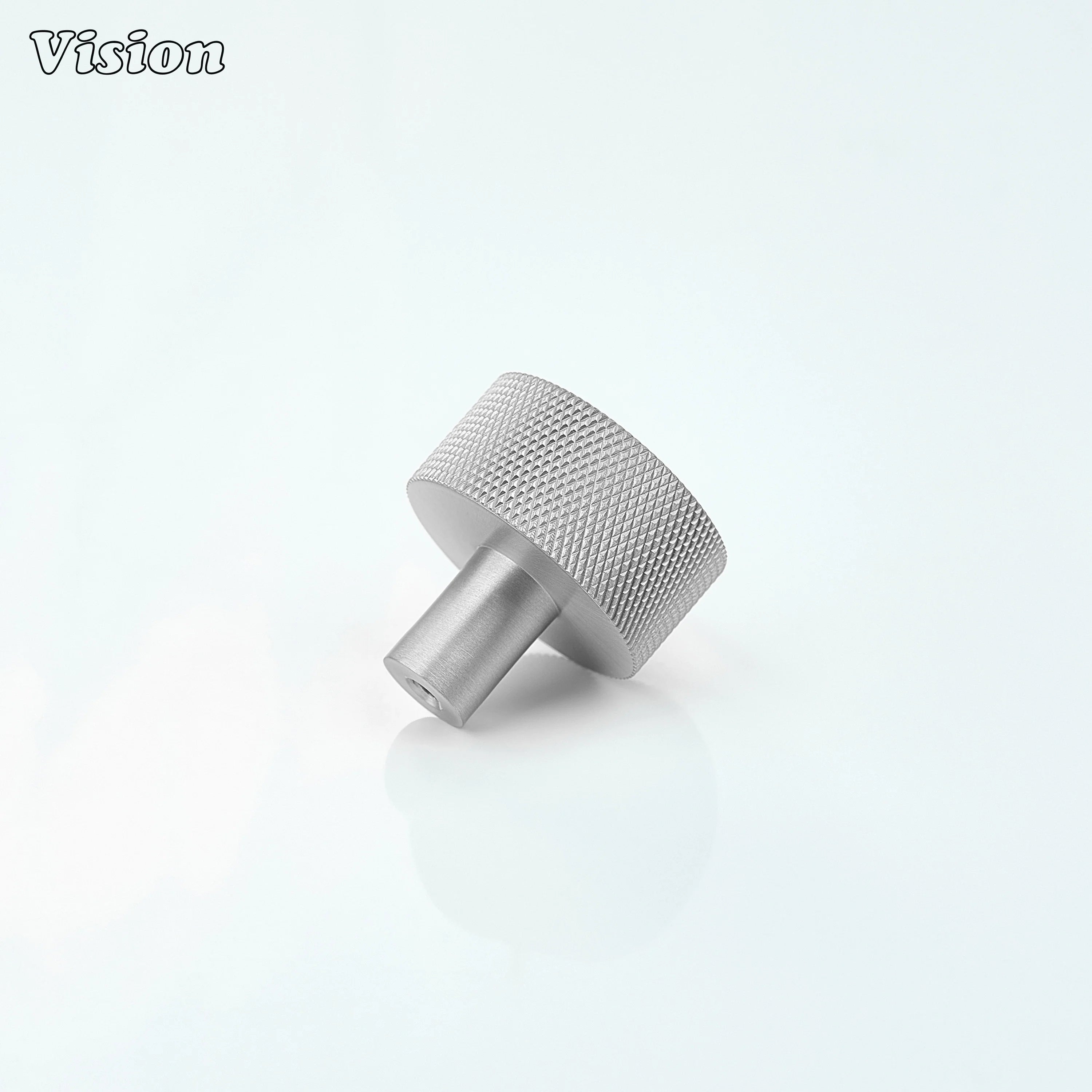 Silver round cabinet knob with textured detail for drawer fronts