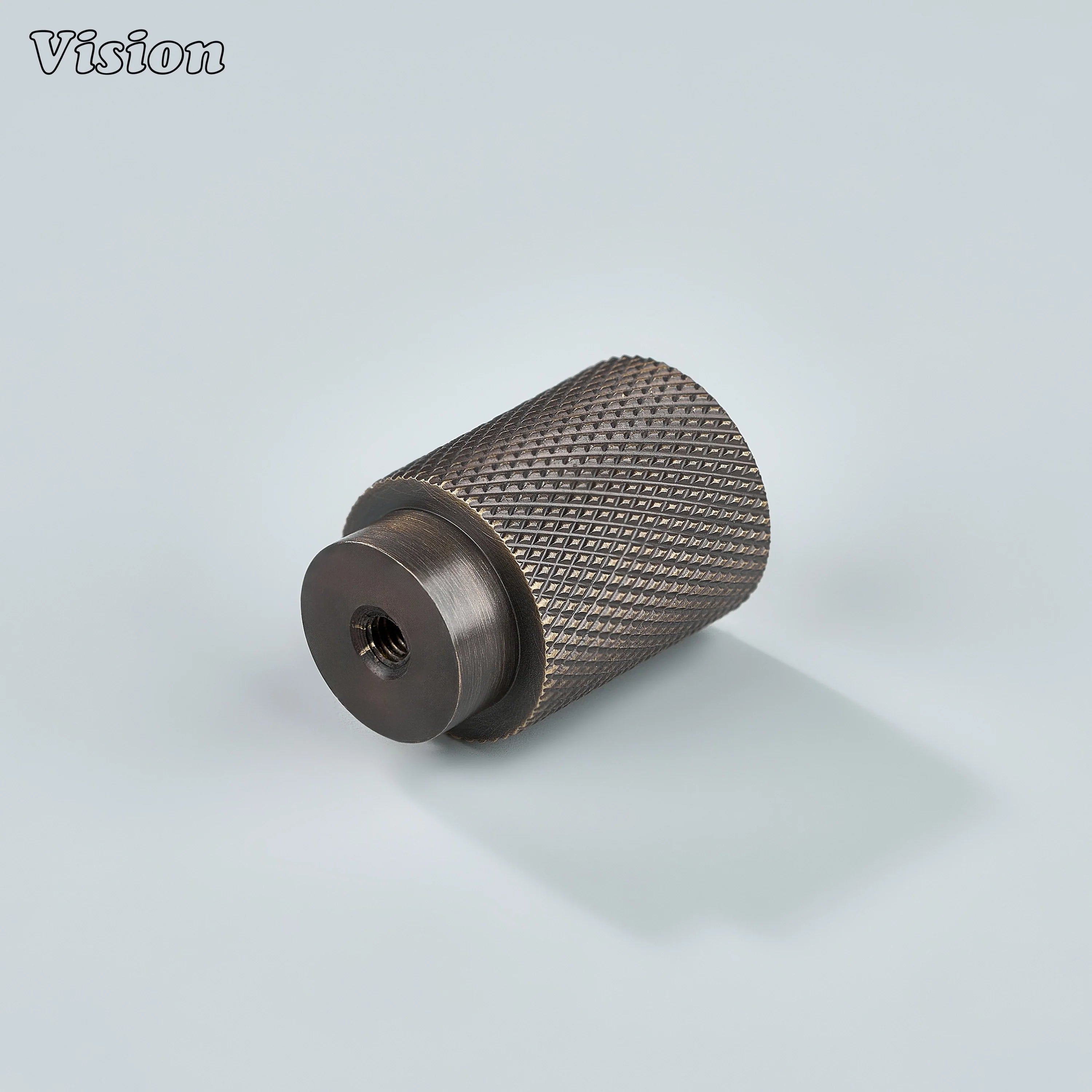 Modern antique bronze knurled cylinder knob used for bathroom cabinets.