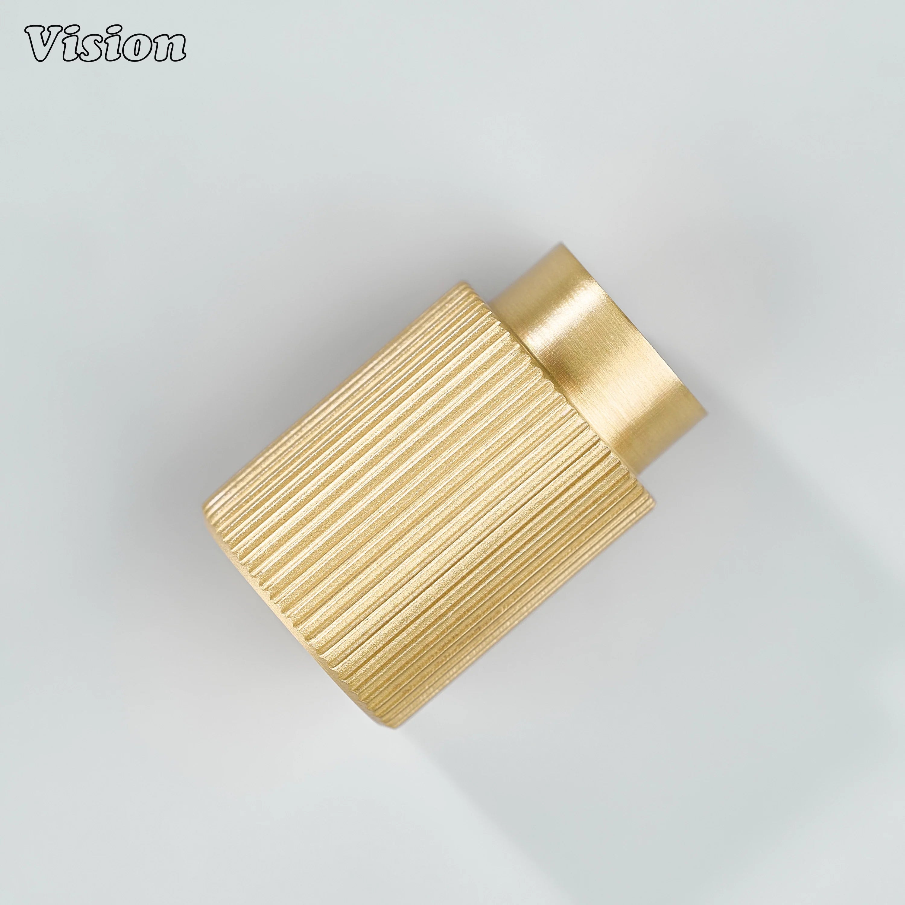 Gold brass knurled cabinet knob in cylindrical profile for kitchen drawers