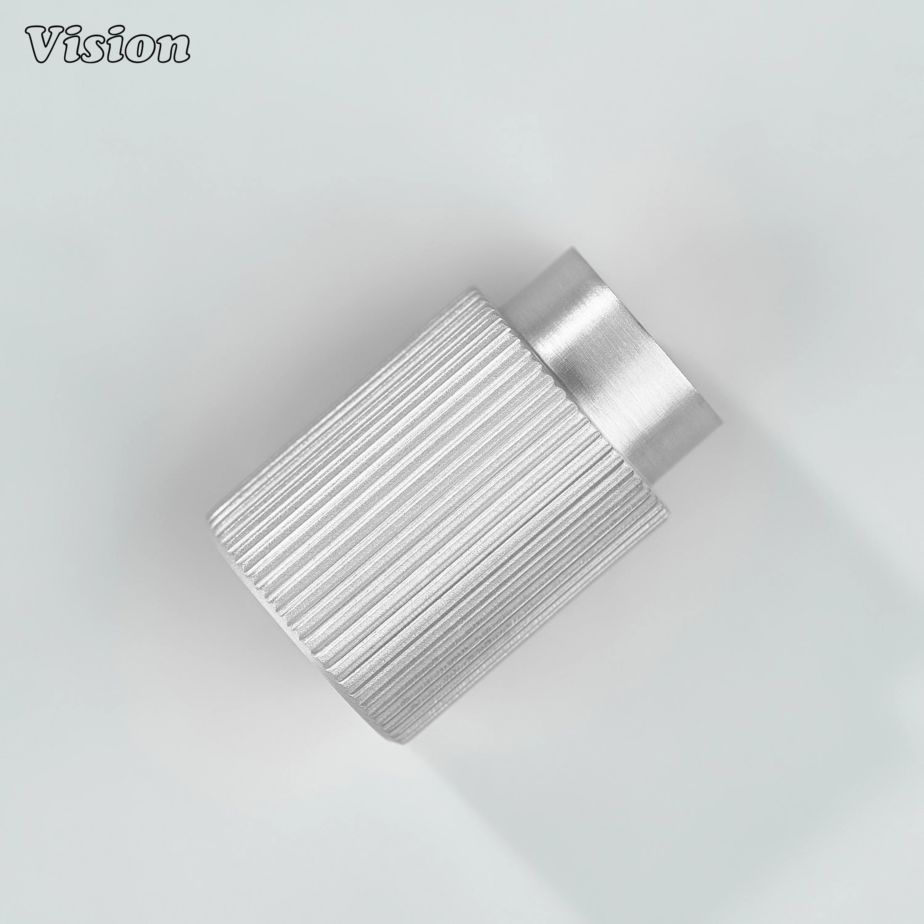 Silver knurled cabinet knob in cylindrical profile for kitchen drawers