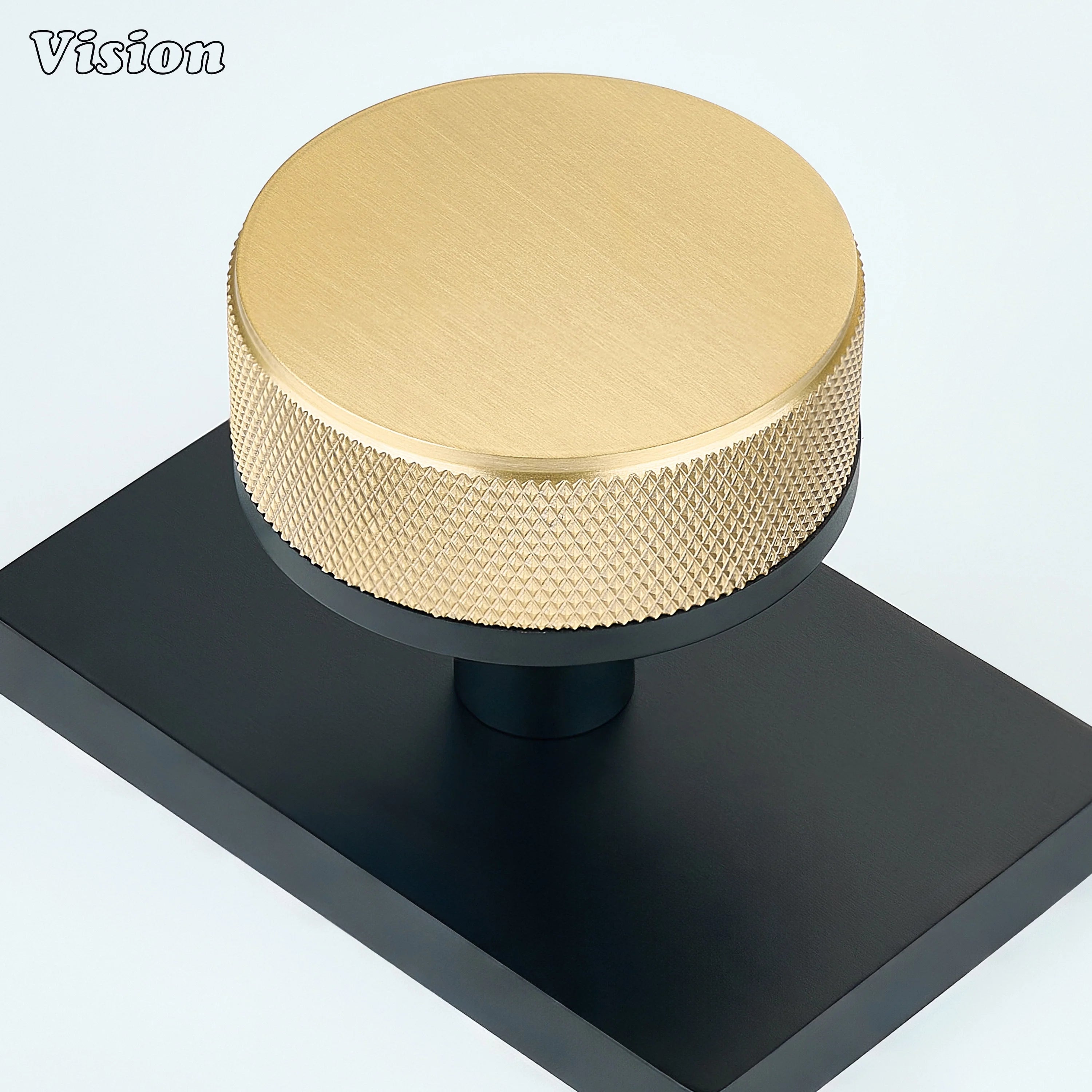 Gold and Black solid brass door knob with contrasting rectangular backplate