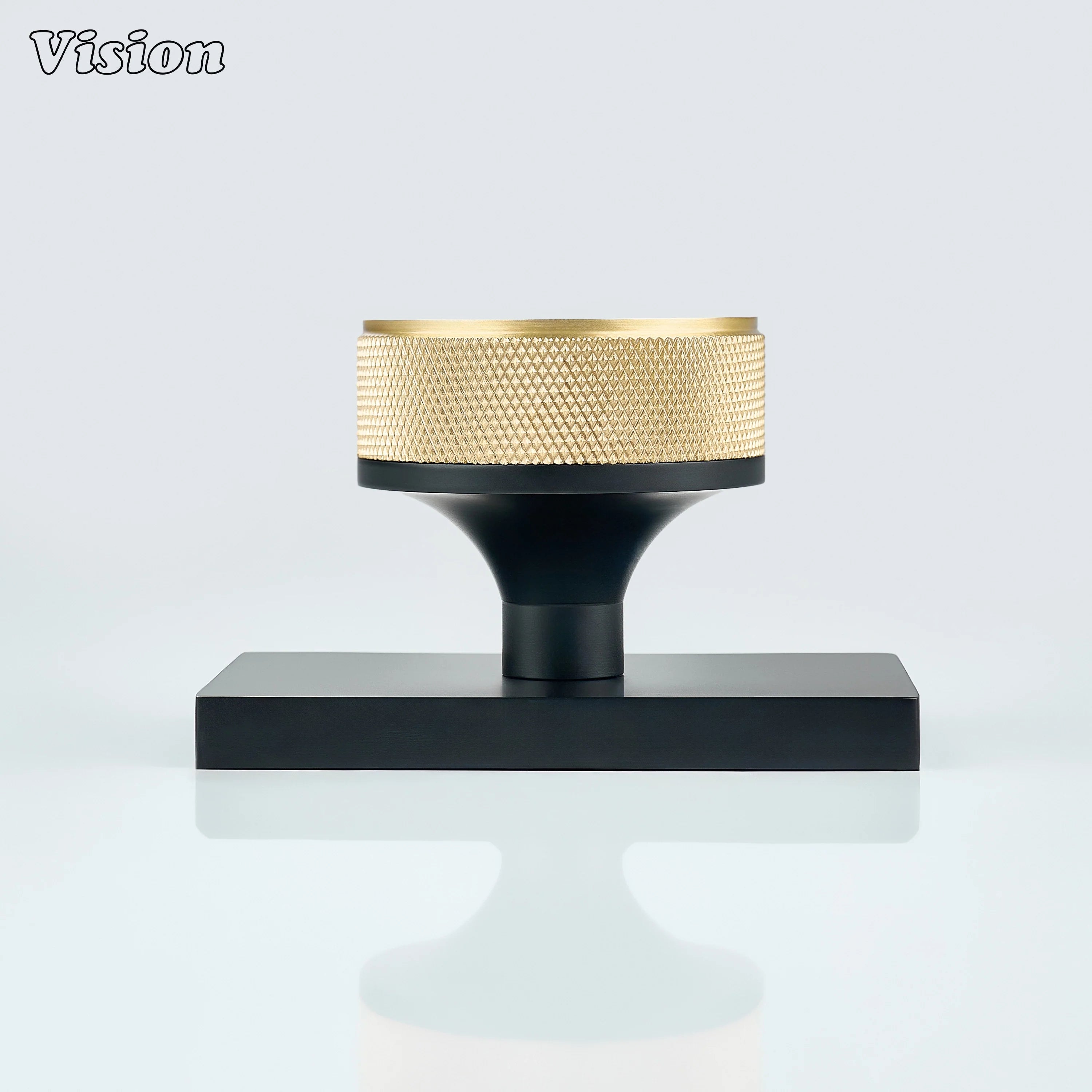Gold and Black door knob with knurled grip and black conceal plate