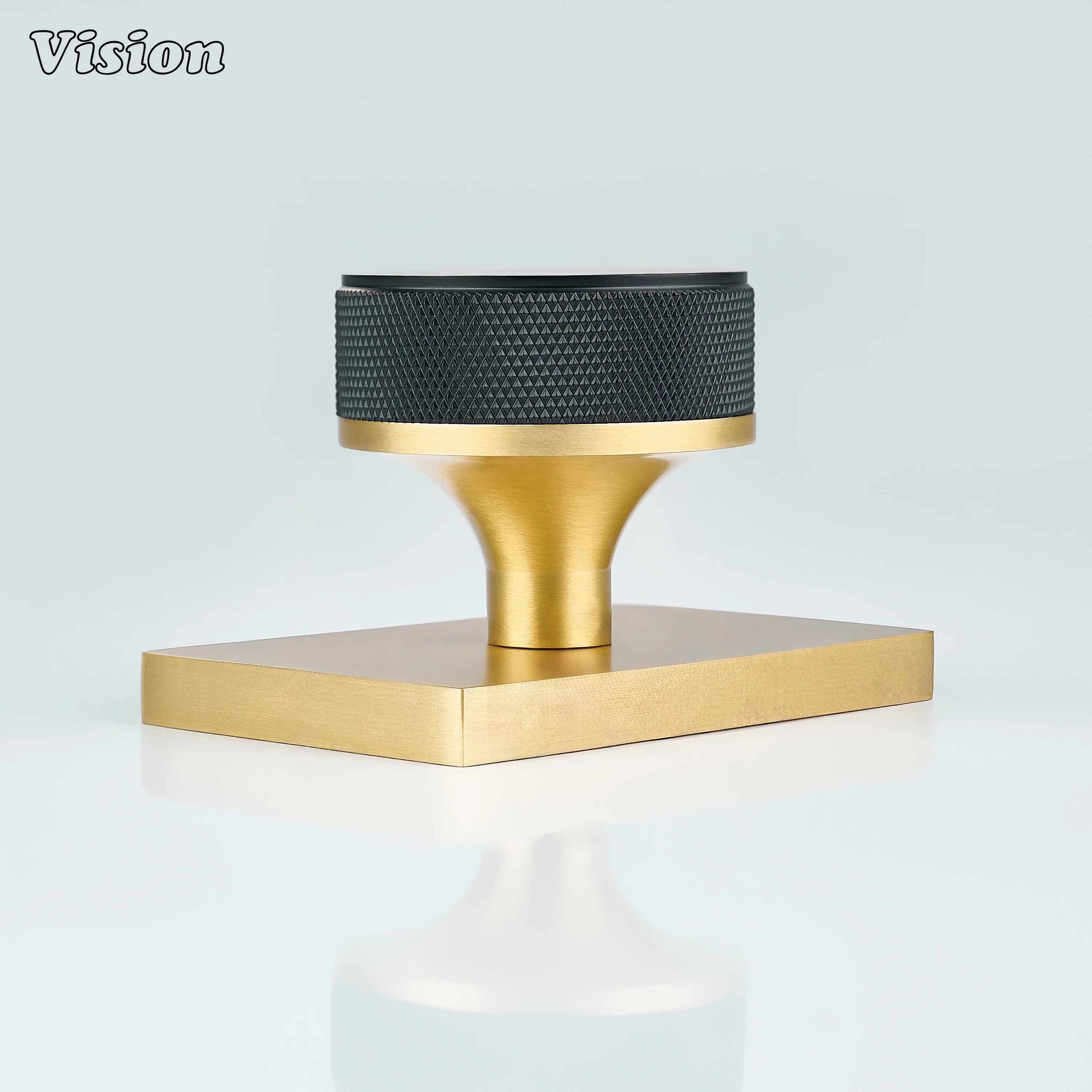 Black and Gold door knob with knurled grip and gold conceal plate