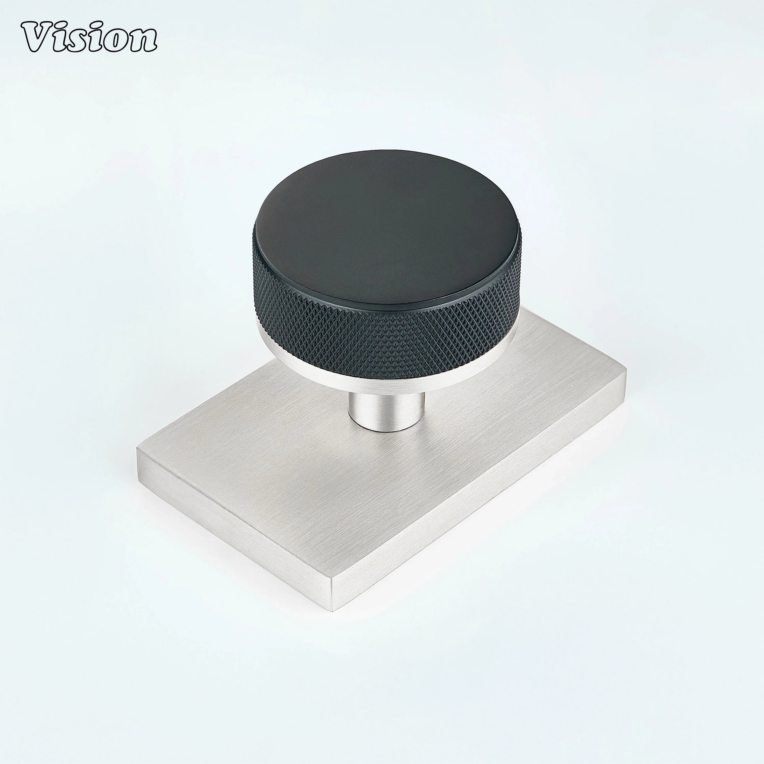 Black and Silver knurled round door knob with black knob and silver rectangular backplate