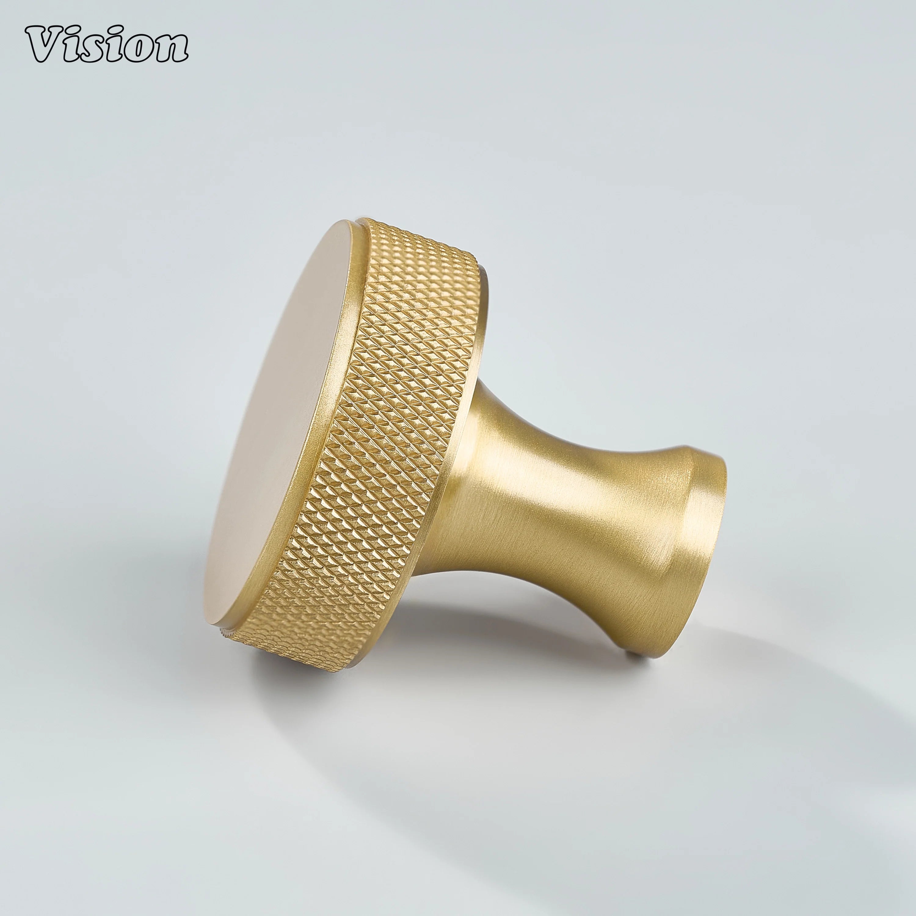 Solid brass round cabinet knob in Gold with knurled grip detail for furniture drawers and cupboards