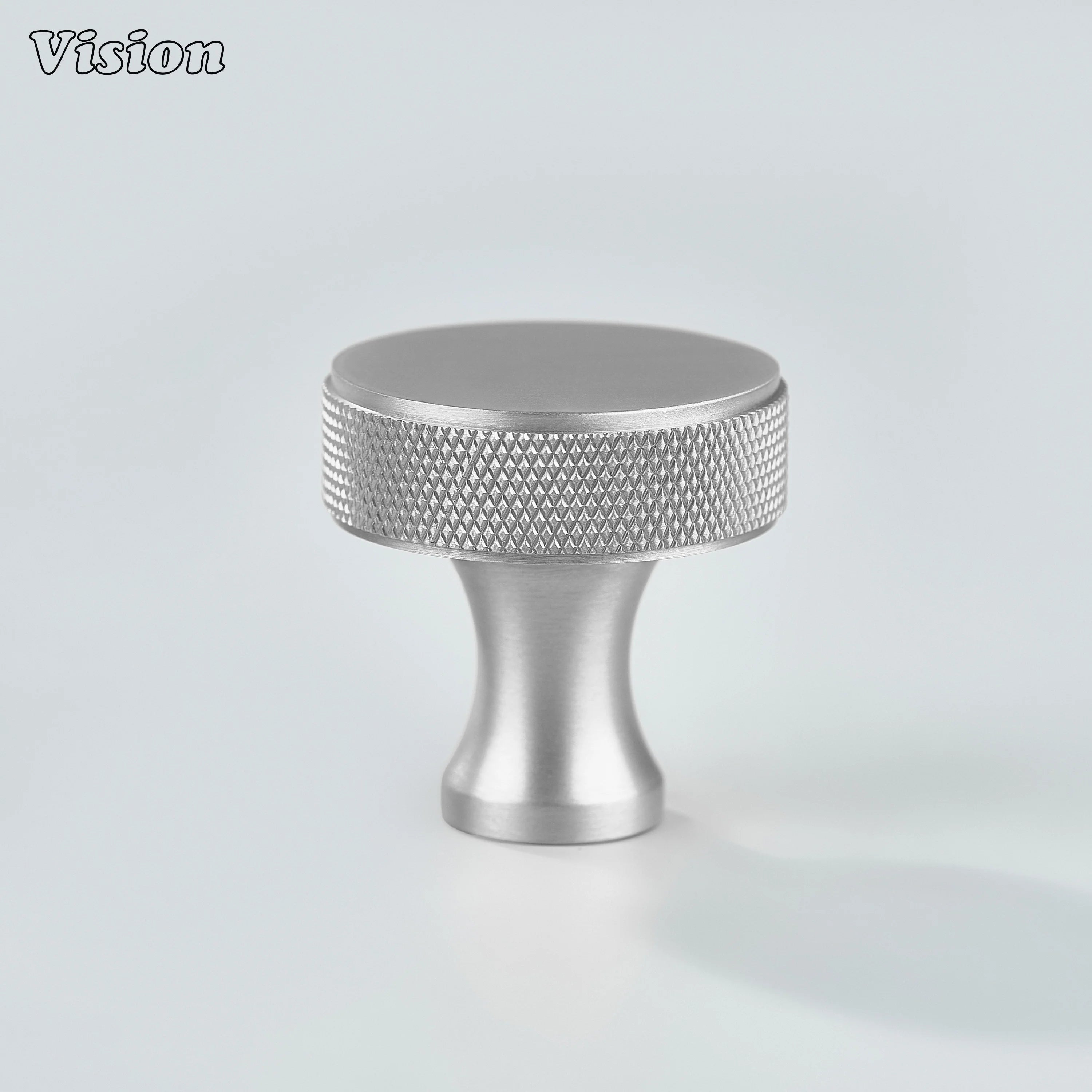 Silver knurled cabinet knob featuring a round brass face for drawers and wardrobes