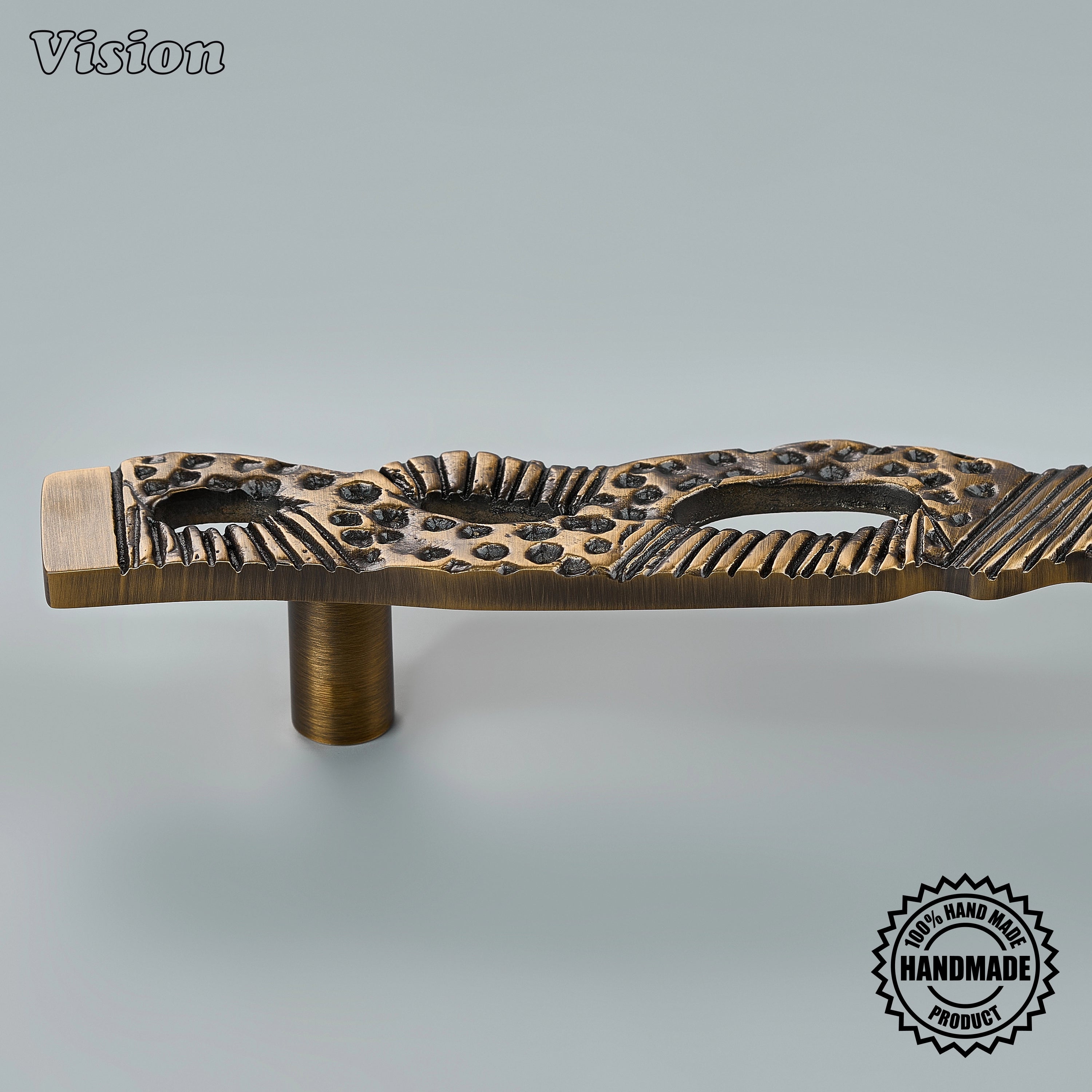 Handcrafted appliance pull in antique bronze finish featuring a textured figure-eight bar for wardrobes
