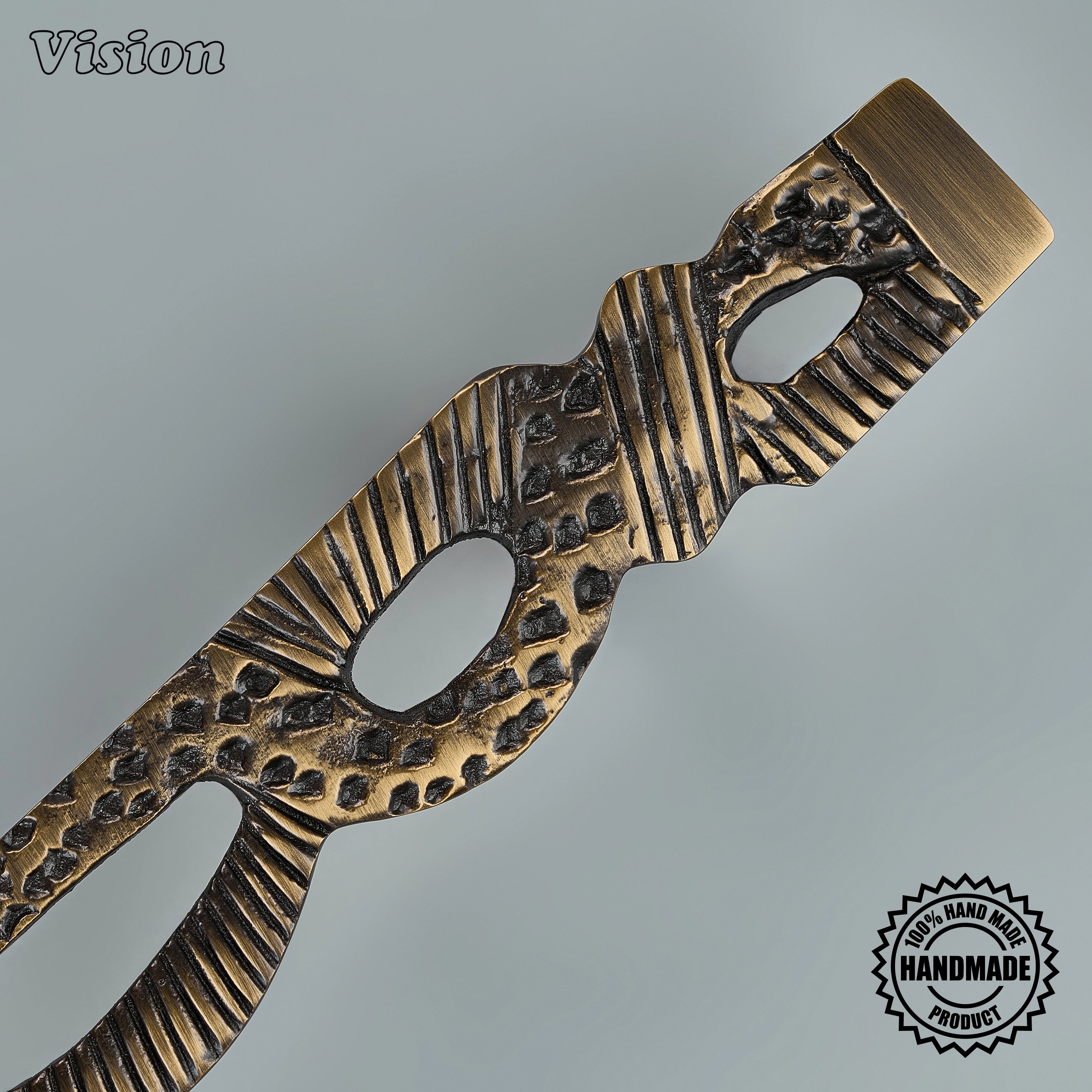 Handcrafted antique bronze appliance pull with organic woven relief on oversized entryway doors