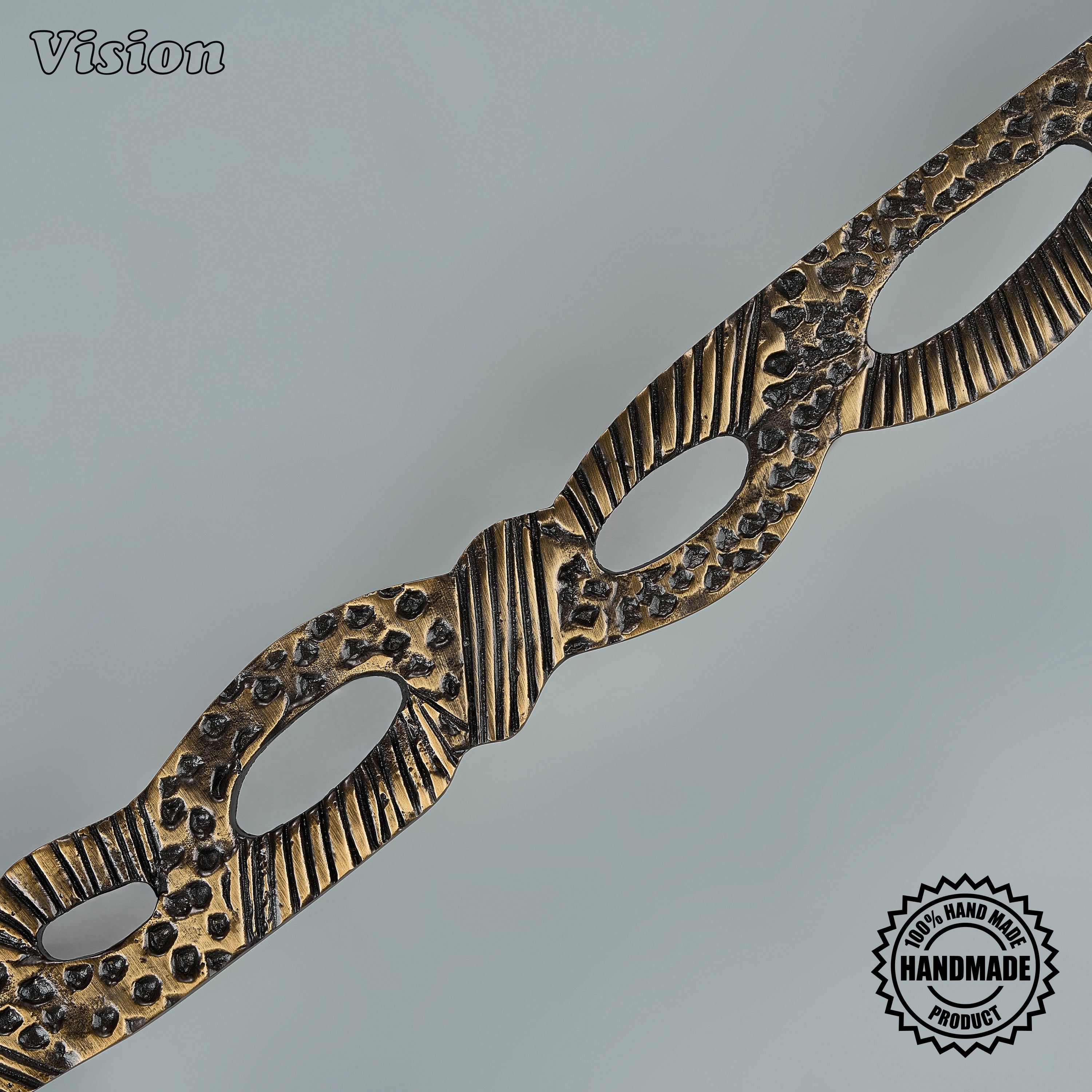 Antique bronze appliance pull featuring a tactile interwoven surface for luxury statement armoires