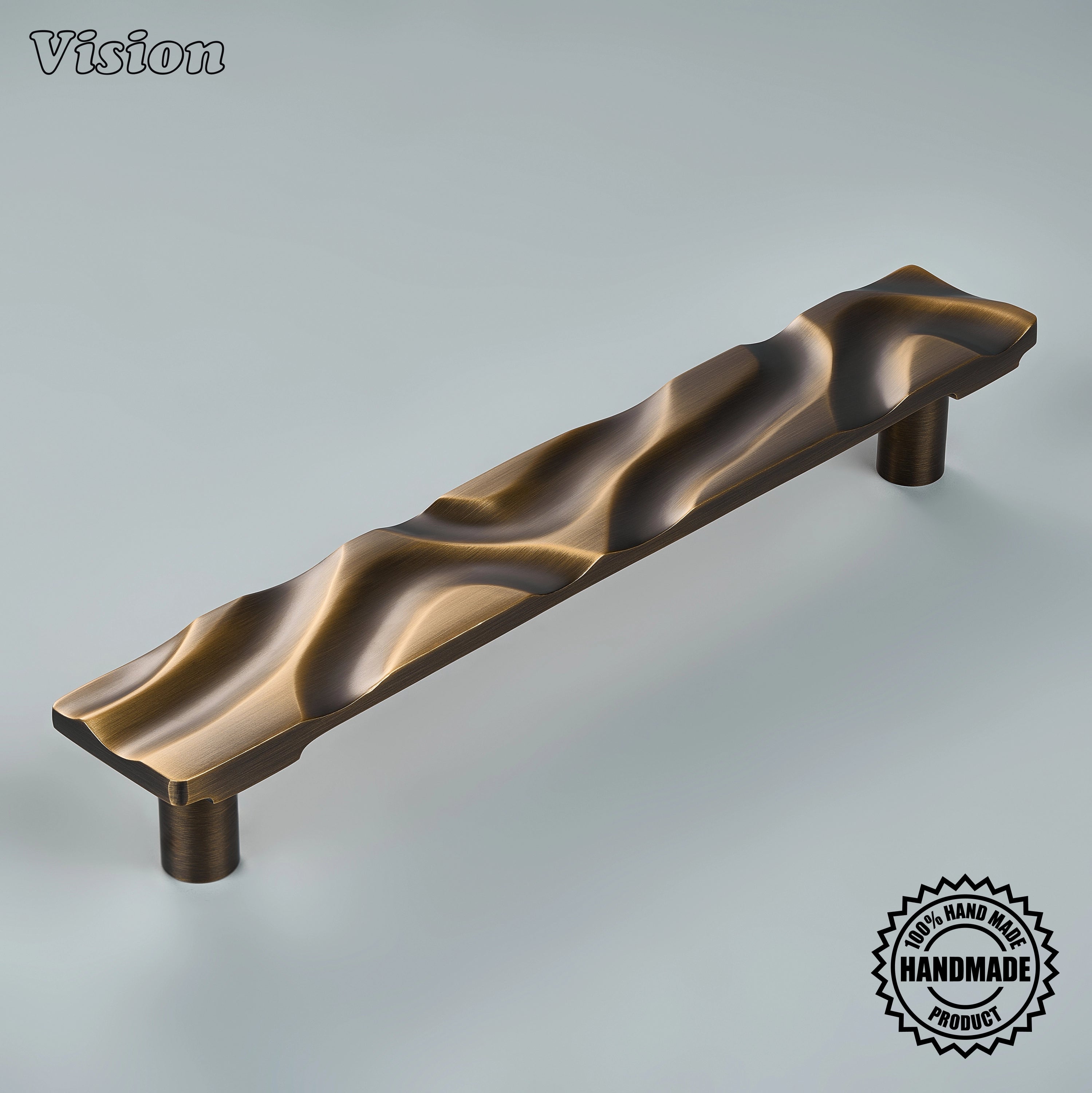Antique Bronze handcrafted appliance pull with sculpted undulating texture on tall custom pantry doors