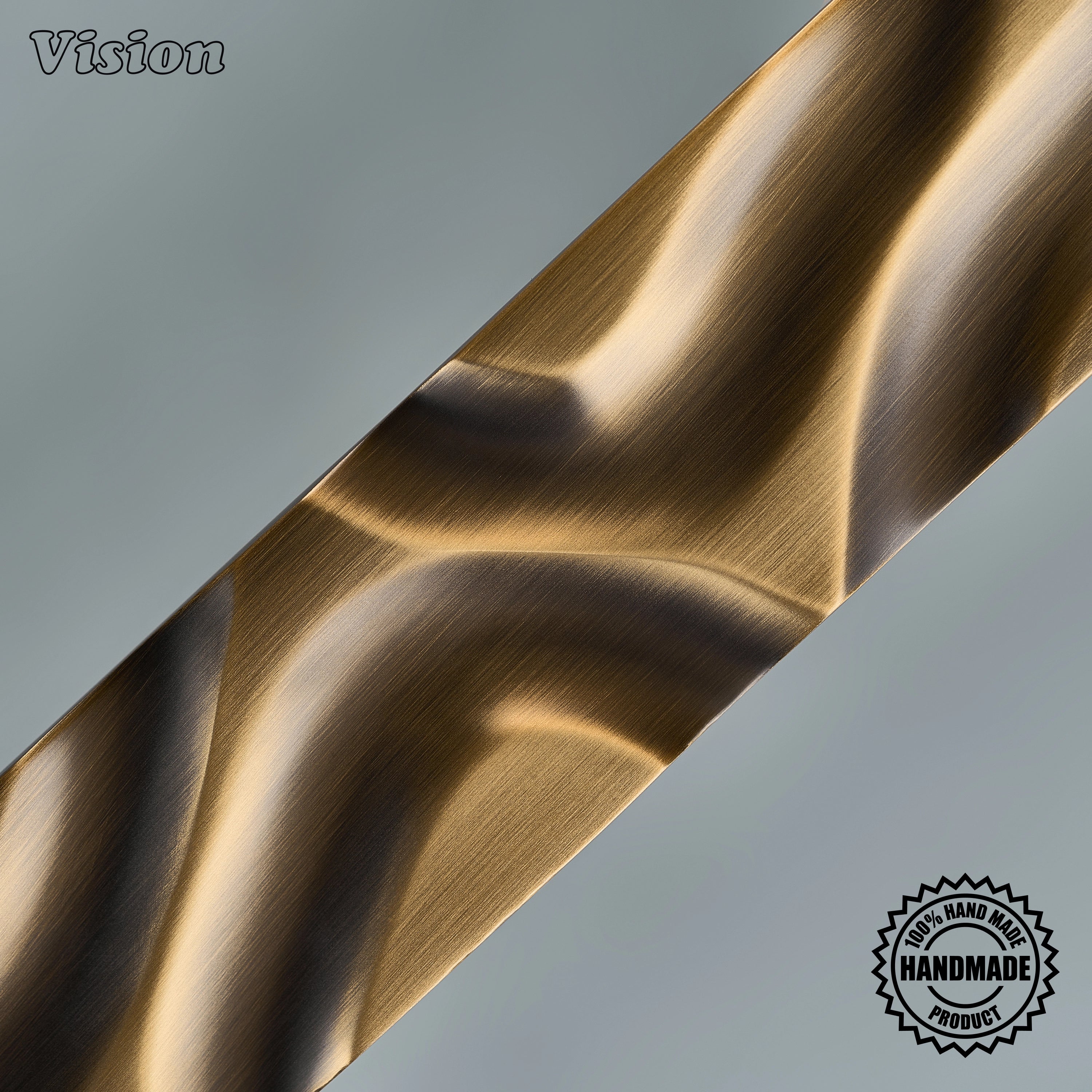 Sculpted antique bronze appliance pull handle with undulating bar profile on paneled freezers
