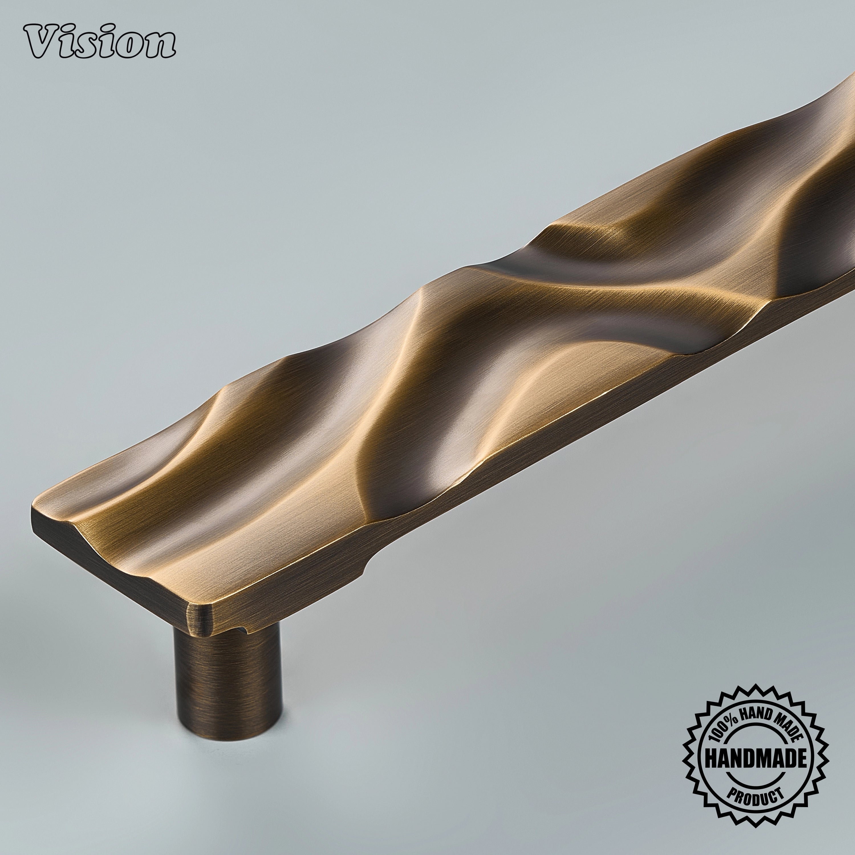 Sculpted antique bronze door handle with organic wave ridges on panel-ready refrigerator panels