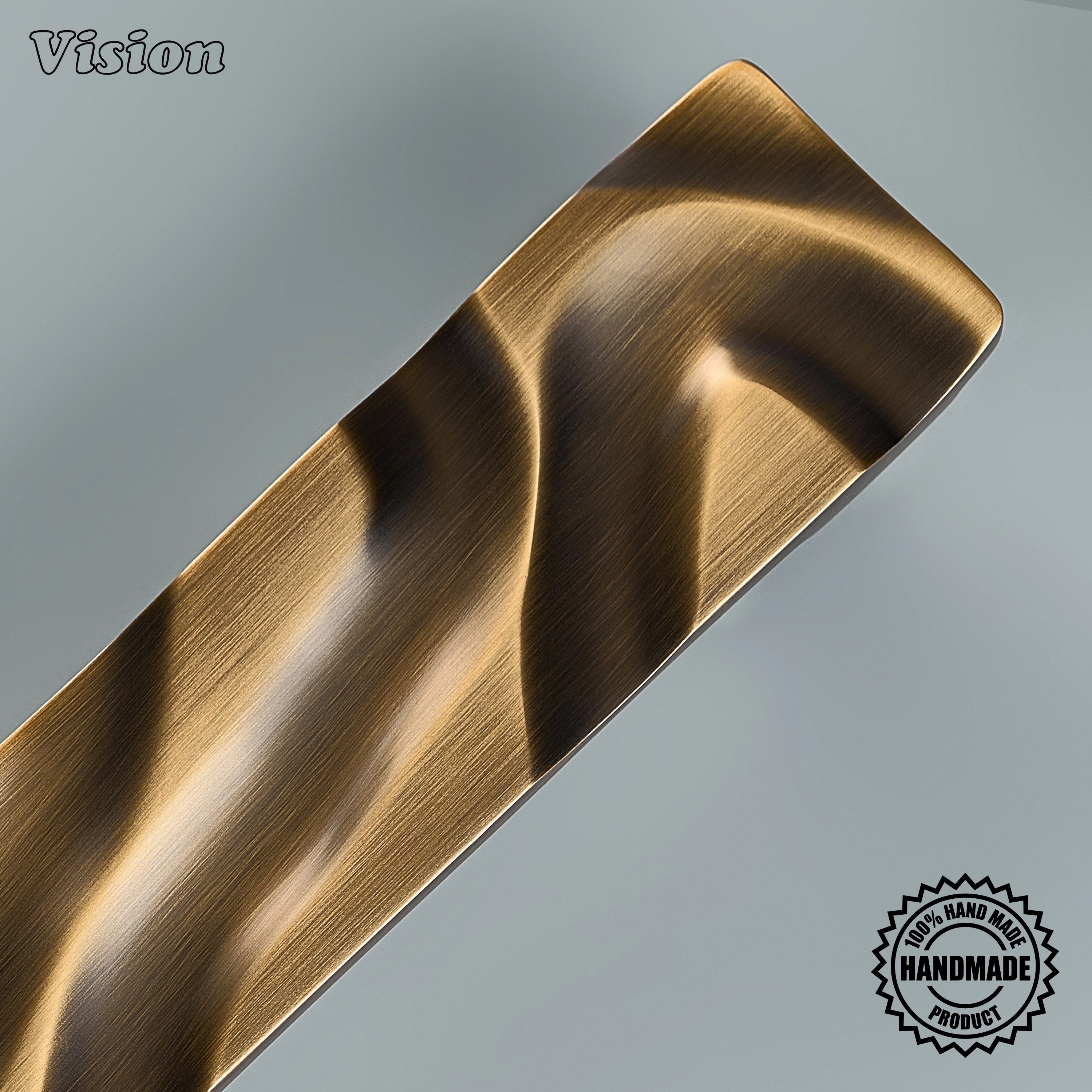 Antique bronze artisanal door handle featuring tactile stream-like relief on interior timber doors