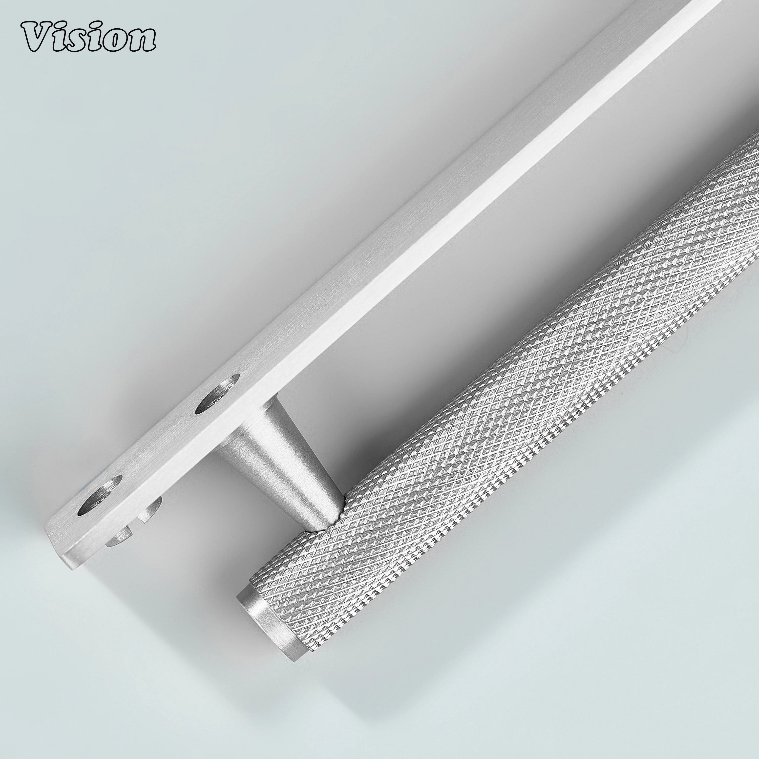 Silver knurled cabinet handle used on wooden drawers